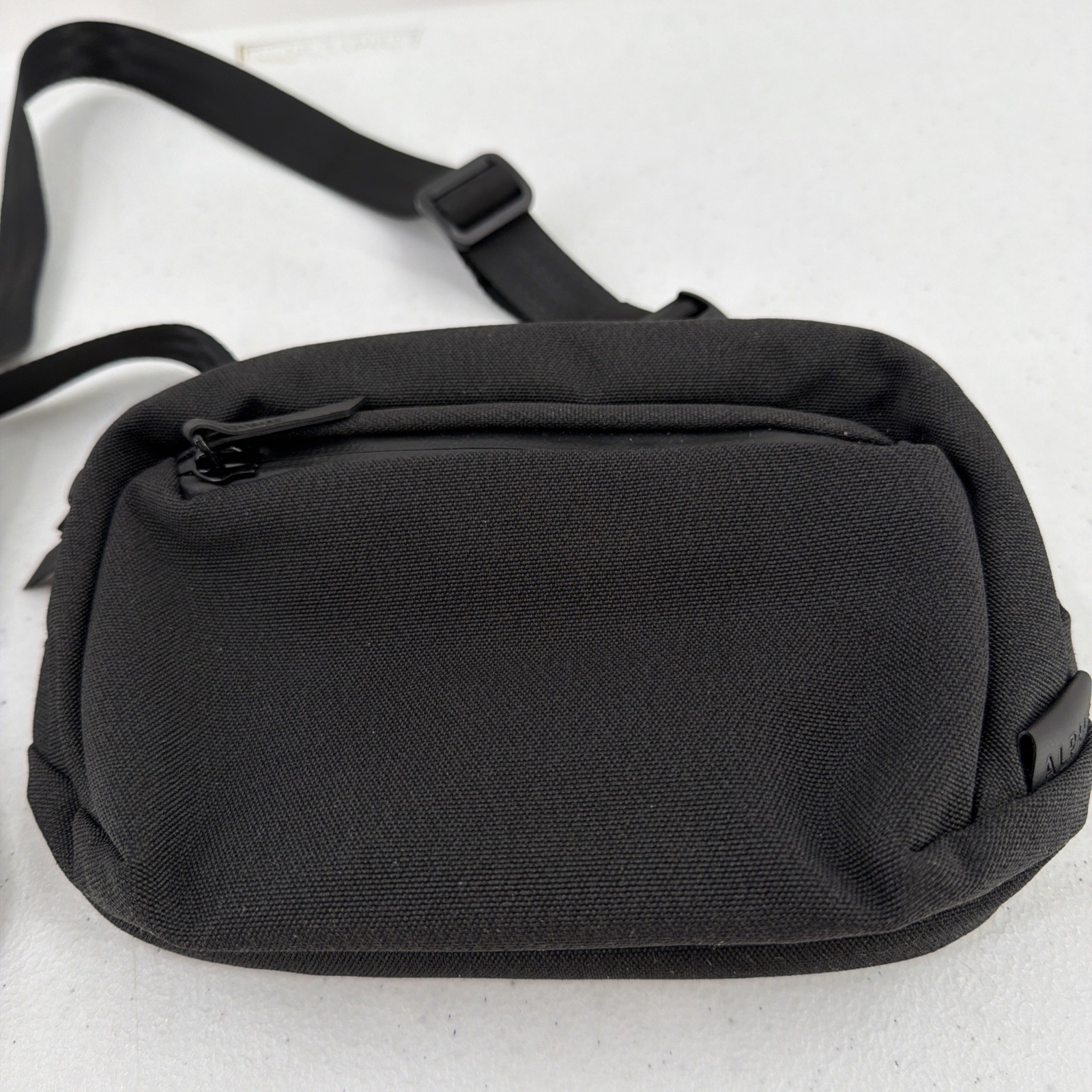 Alpaka Sling Bag Black Pockets Zip Adjustable Clean