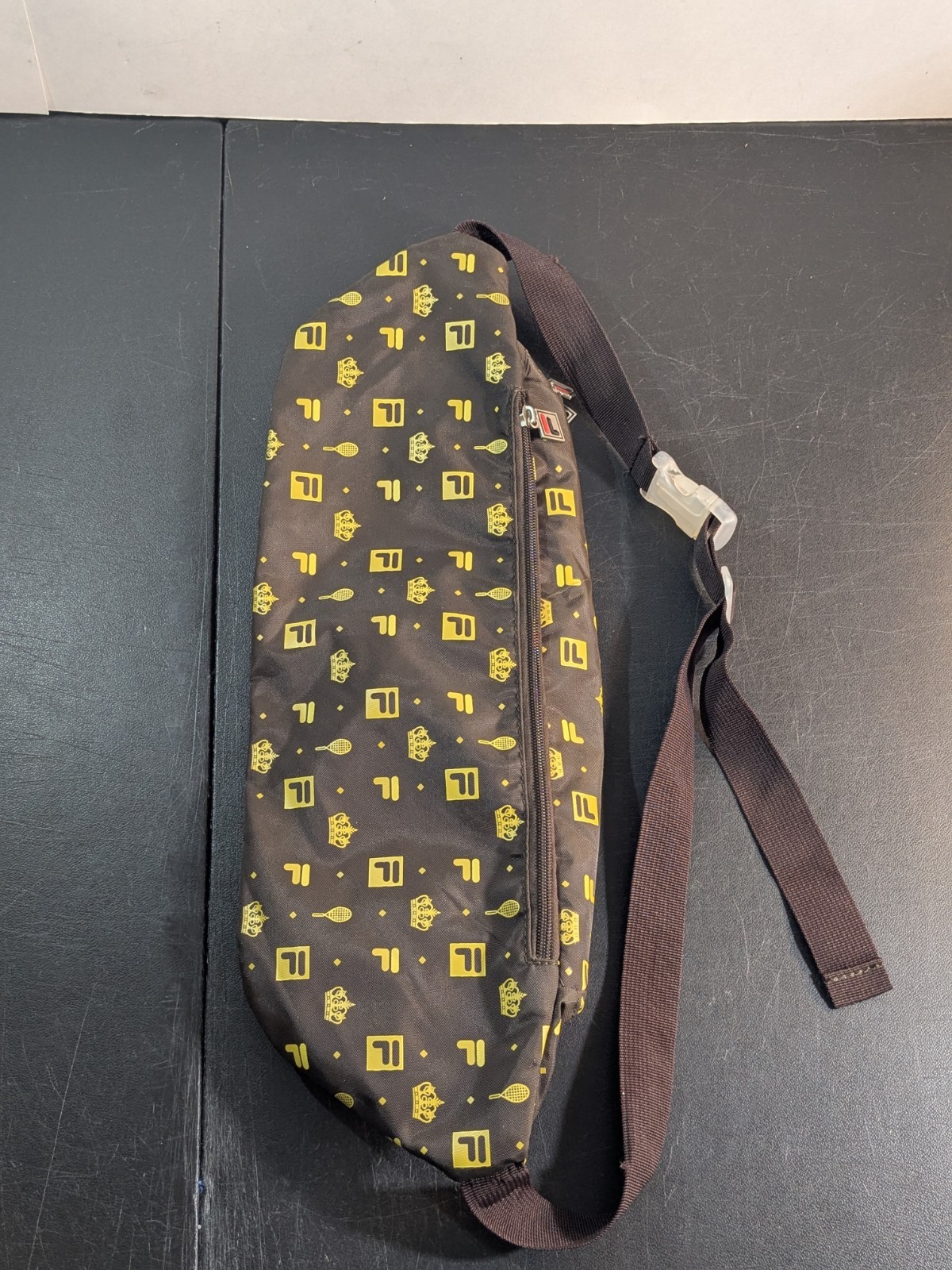 FILA + Urban Outfitters Monogram Sling Bag | 20″x7″x5″ Fanny Pack