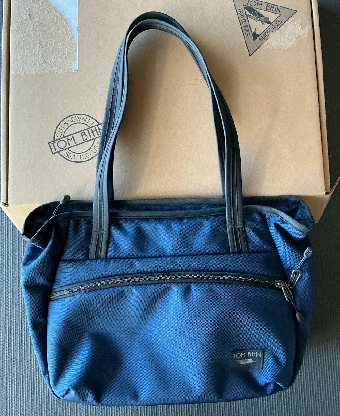 Tom Bihn Nomad Tote 11 Liters Deep Blue Ballistic Exterior, Orange Zest Interior