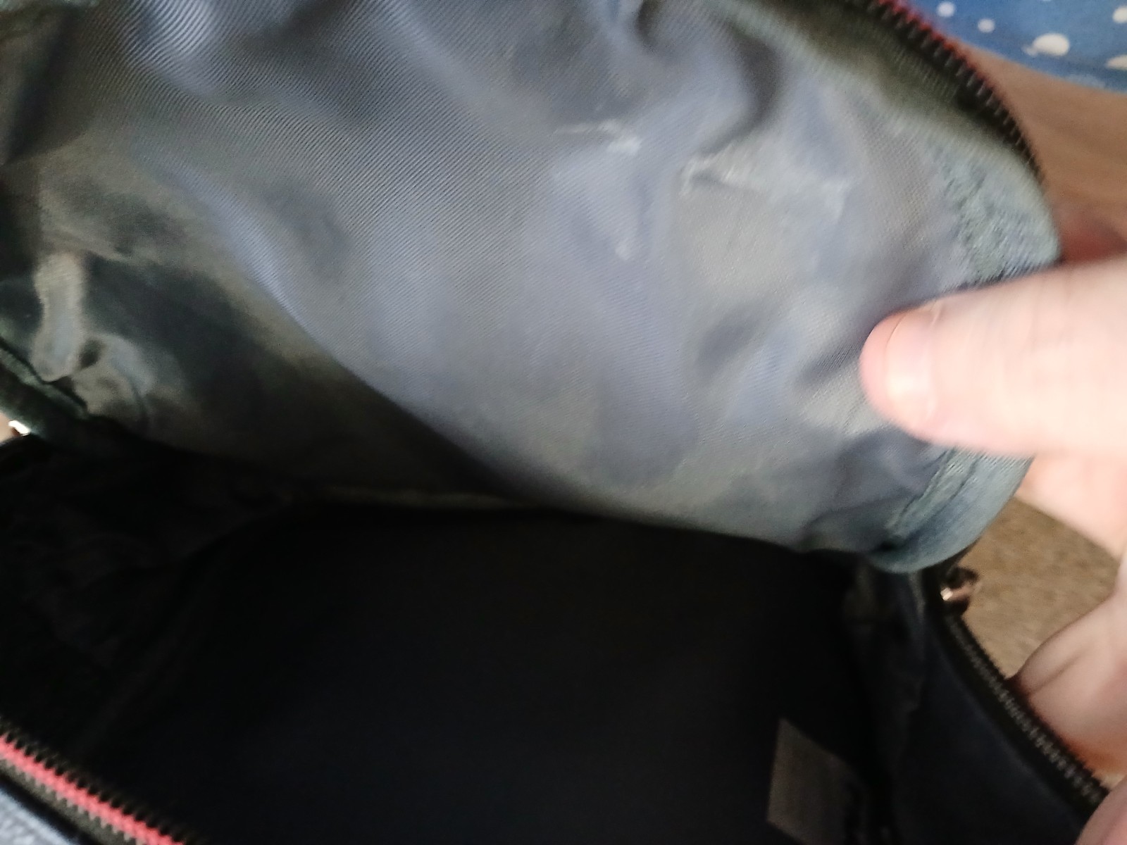 FILA SMALL BLACK BACKPACK WITH SIGNATURE ACROSS FRONT HAS 2 ZIPPERED SECTIONS