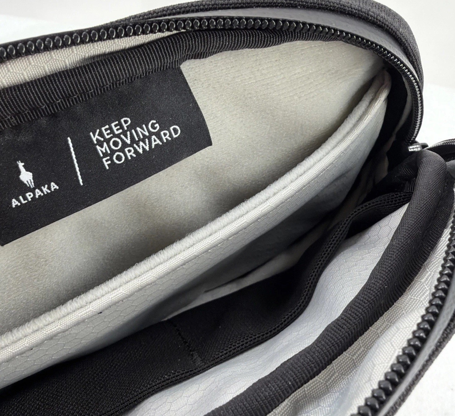 Alpaka Sling Bag Black Pockets Zip Adjustable Clean
