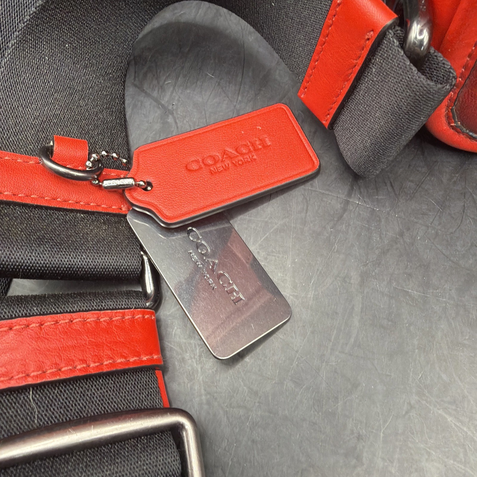 COACH Track Sling Backpack in Colorblock with Stamp in Red Ivory Orange