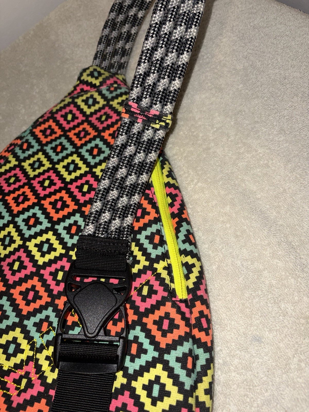 KAVU Multicolor Geometric Sling Bag Adj Crossbody Rope Zip Closure Cup Holder