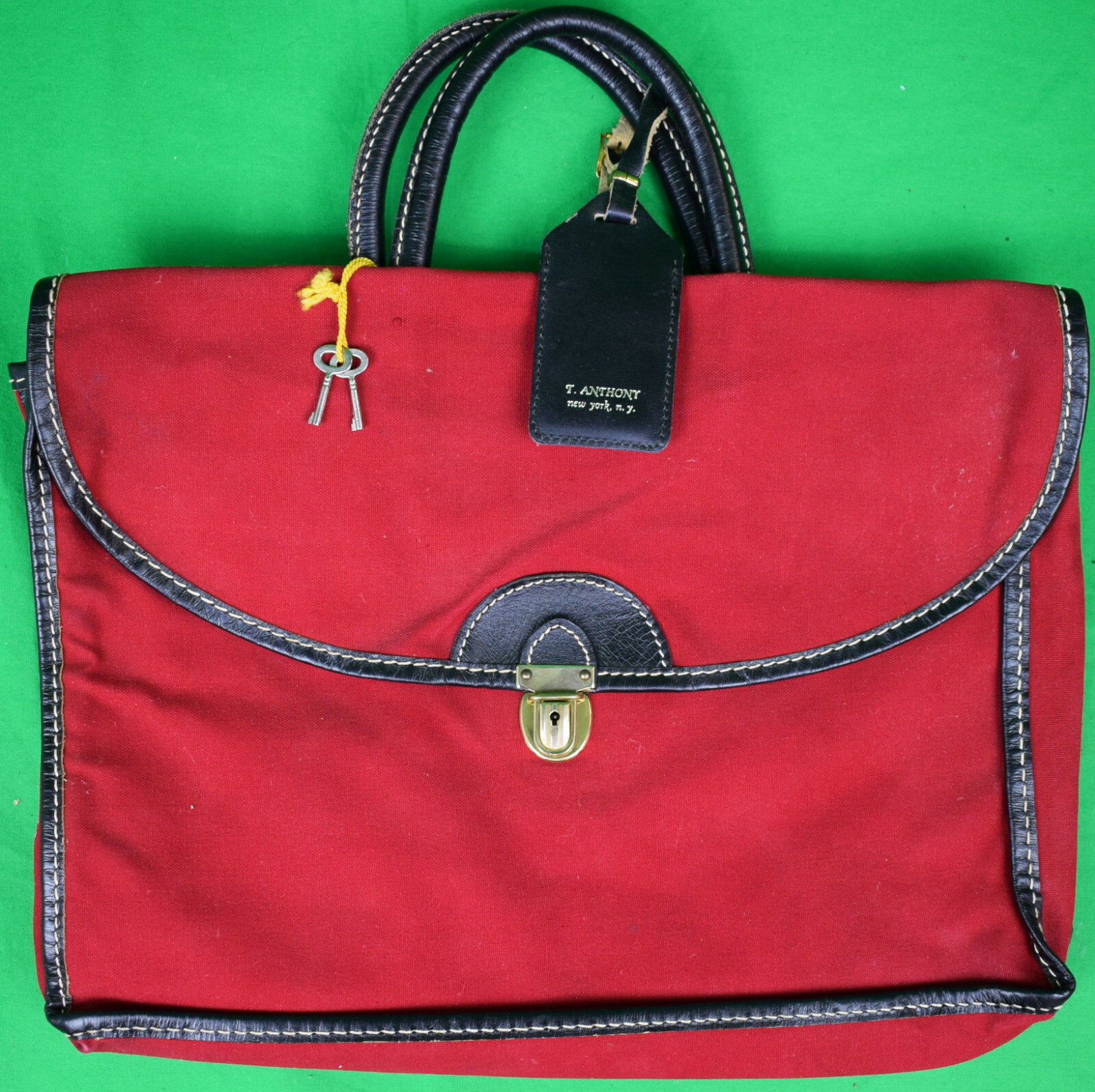 “T. Anthony Red Canvas Carrier Bag w/ Luggage Tag”