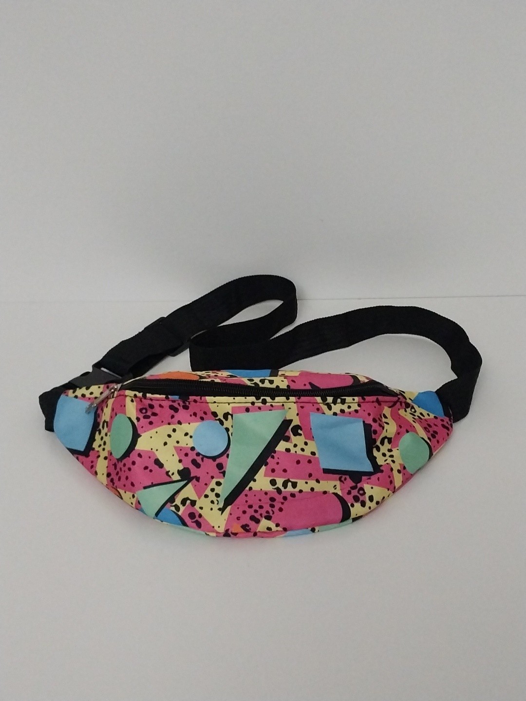 80s or 90s style Memphis pattern fanny pack with a black adjustable strap and…