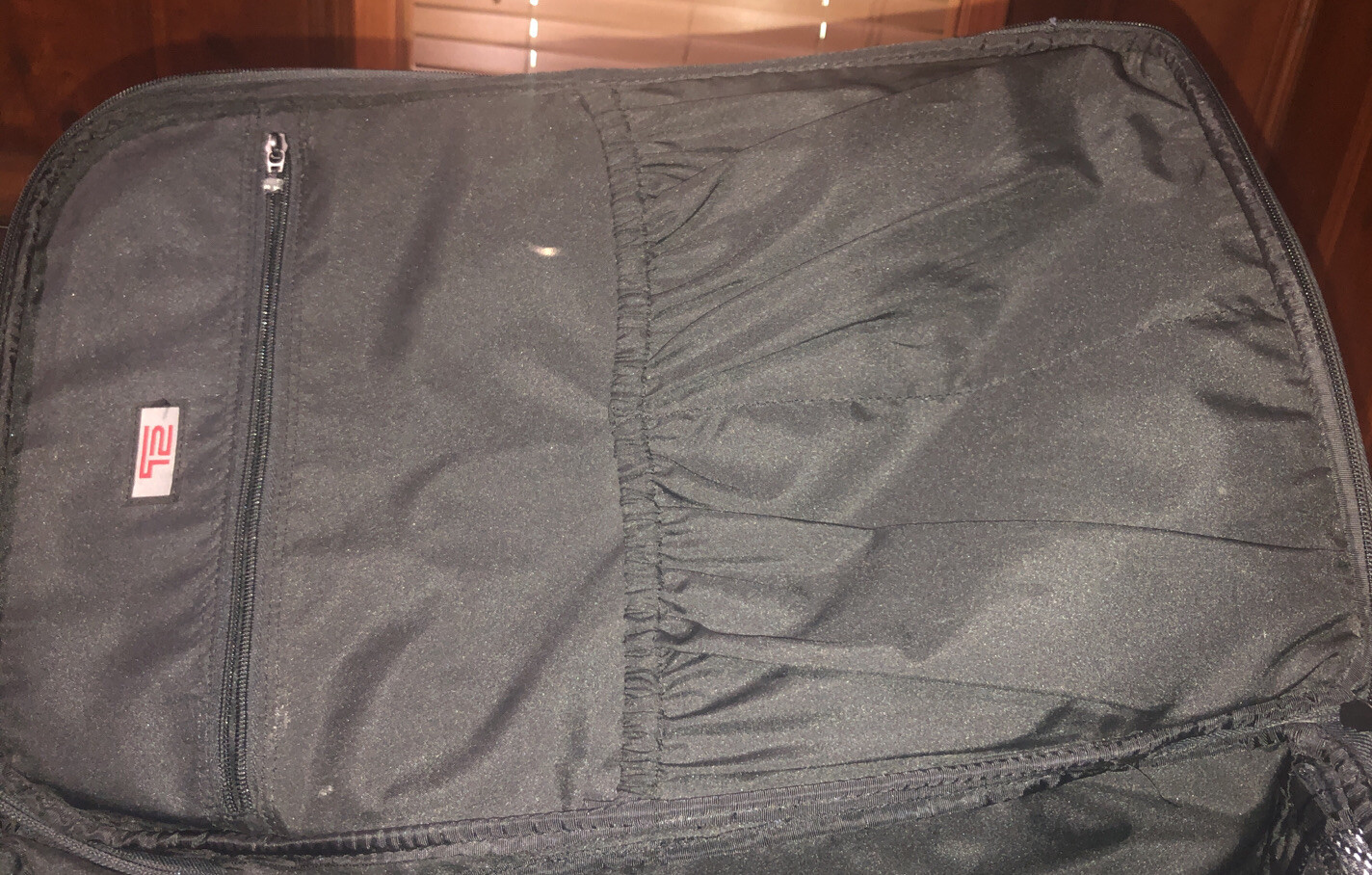 Used Tumi T2 Nylon Olive Green and Black Backpack Suitcase With Wheels.