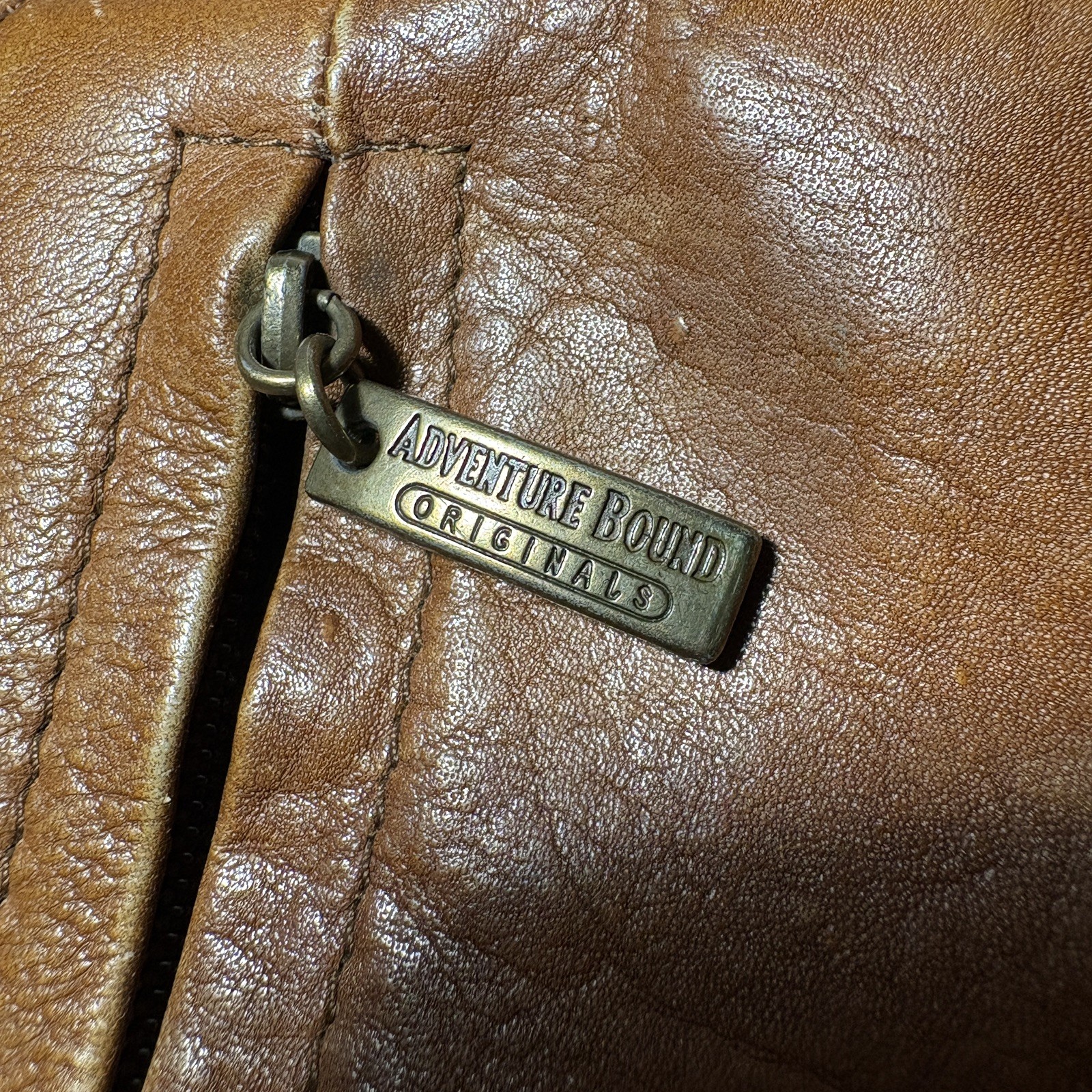 Vintage Wilsons Leather Crossbody Bag with adjustable strap and five pockets