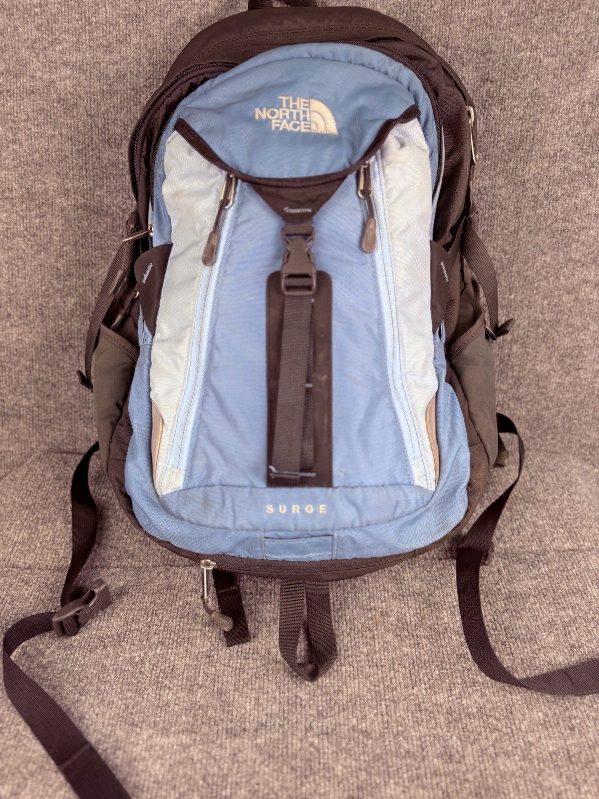 The North Face Surge Backpack Sky Blue Front Grey Back And Green Side Pockets