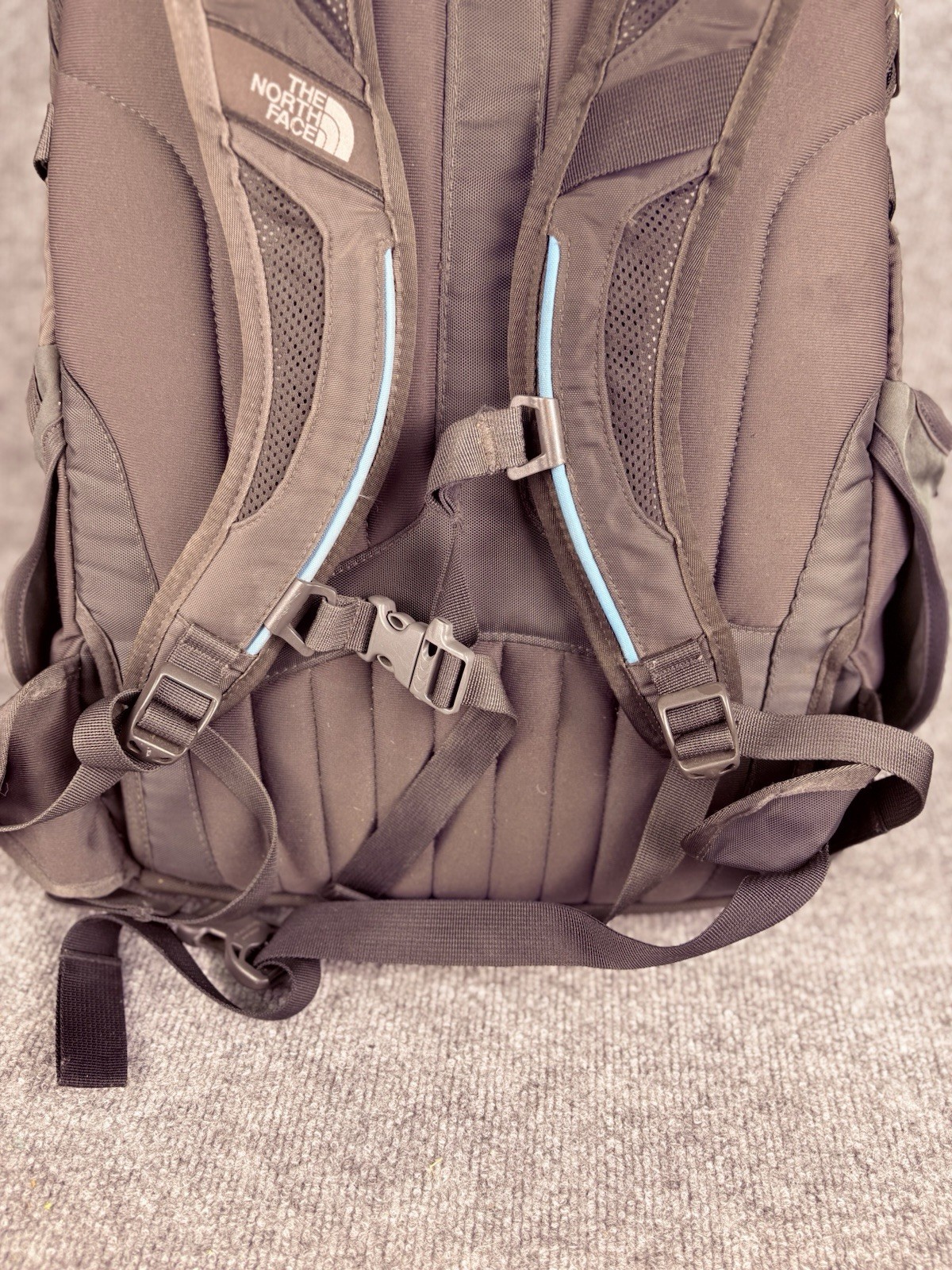 The North Face Surge Backpack Sky Blue Front Grey Back And Green Side Pockets