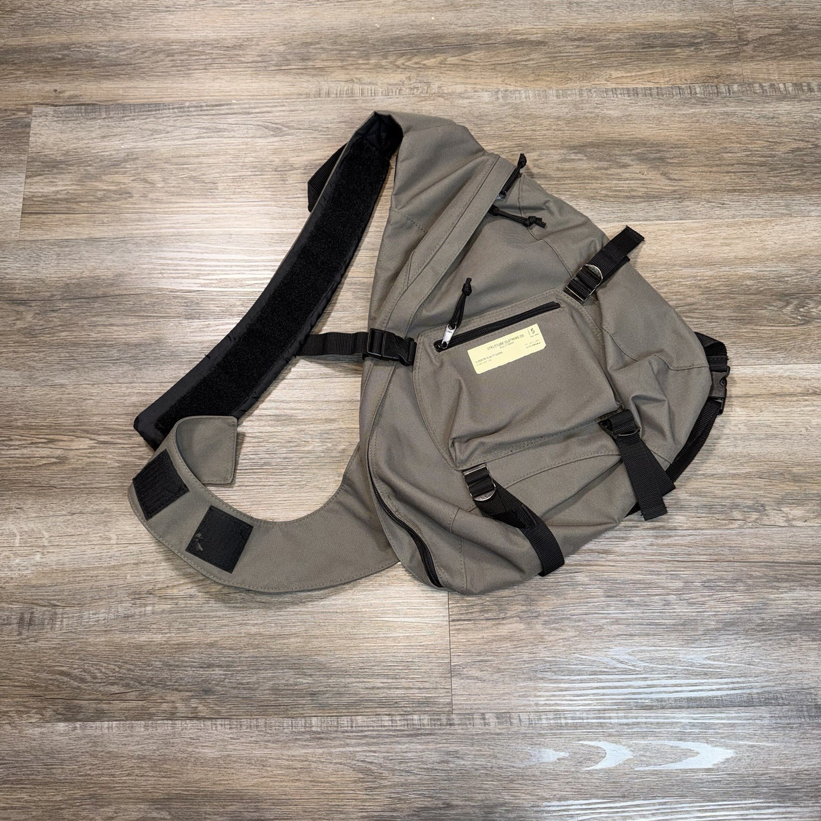 Structure Clothing Co. Sling BackPack Gray w/Black Straps Labeled Front Pocket