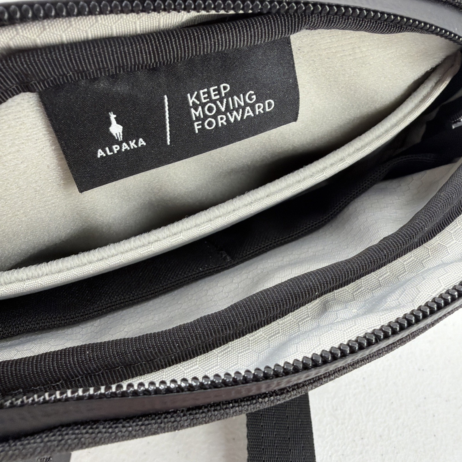 Alpaka Sling Bag Black Pockets Zip Adjustable Clean