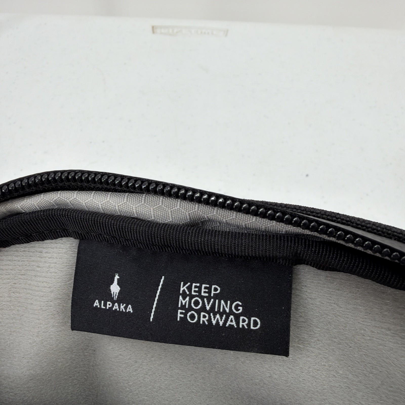 Alpaka Sling Bag Black Pockets Zip Adjustable Clean