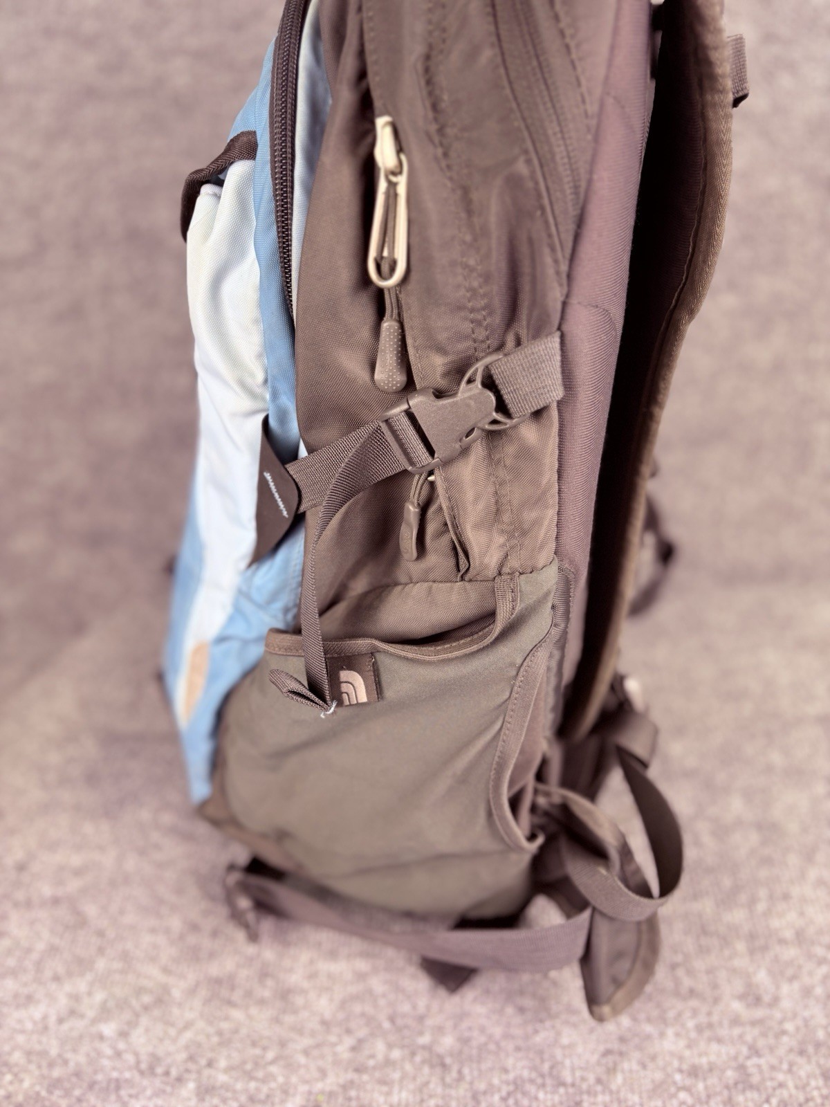 The North Face Surge Backpack Sky Blue Front Grey Back And Green Side Pockets