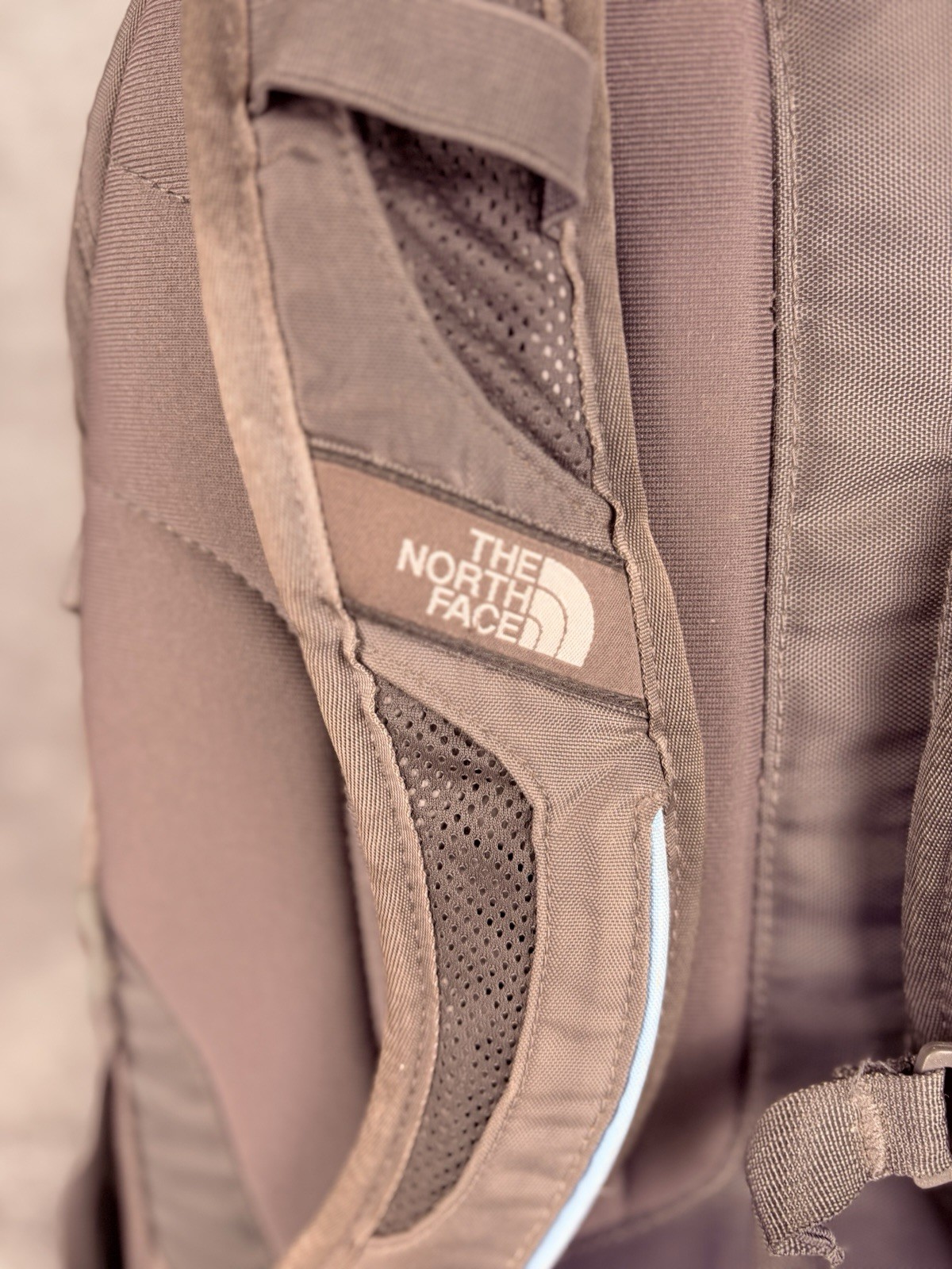 The North Face Surge Backpack Sky Blue Front Grey Back And Green Side Pockets