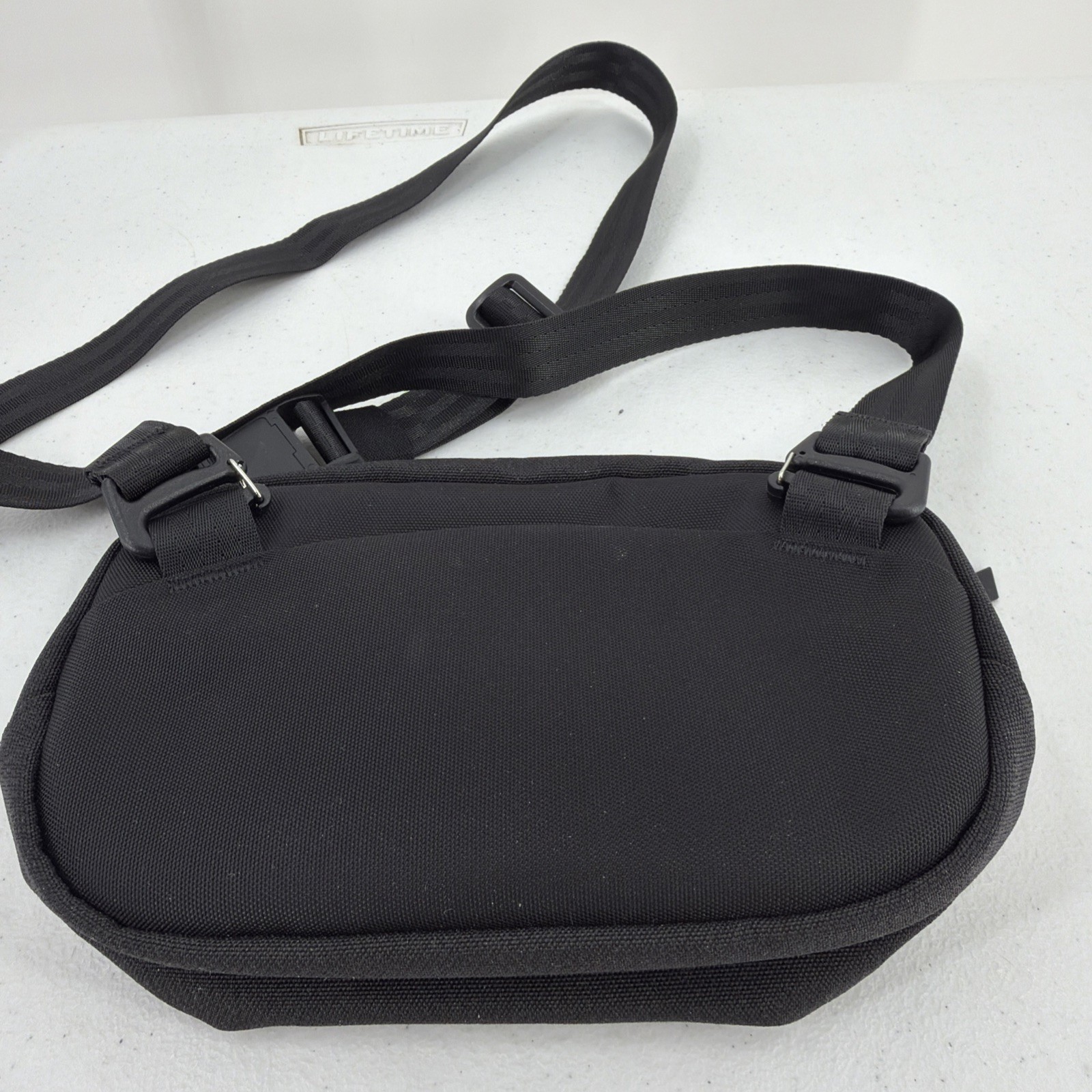 Alpaka Sling Bag Black Pockets Zip Adjustable Clean