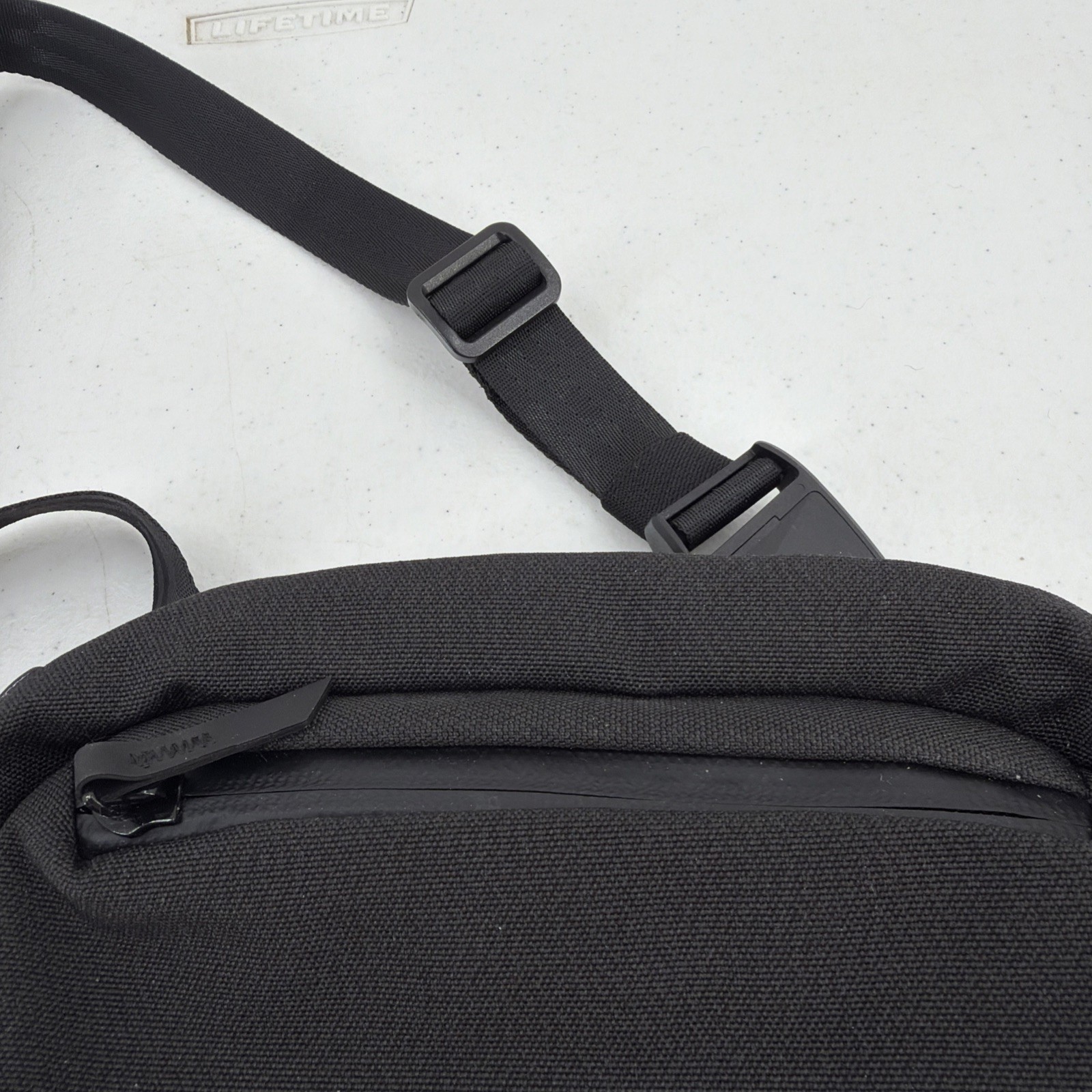 Alpaka Sling Bag Black Pockets Zip Adjustable Clean
