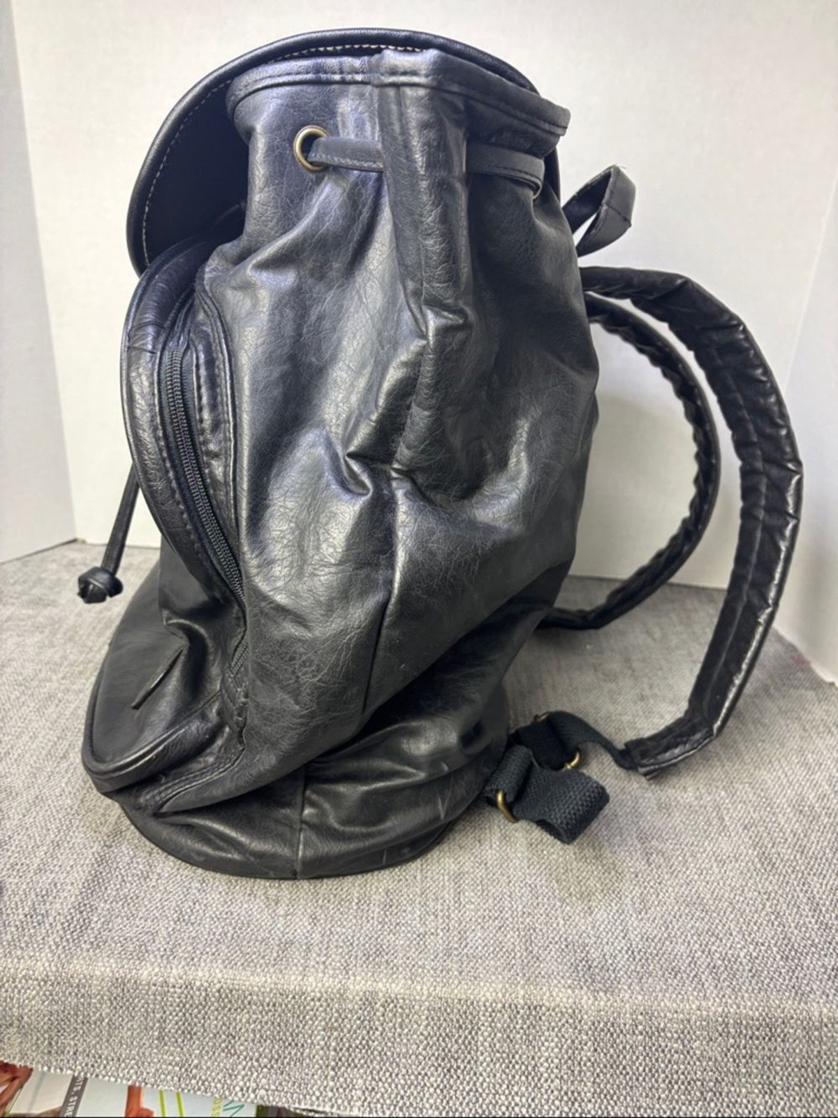 Tandem Black Leather Drawstring Backpack with Buckled Flap Cascade Falls