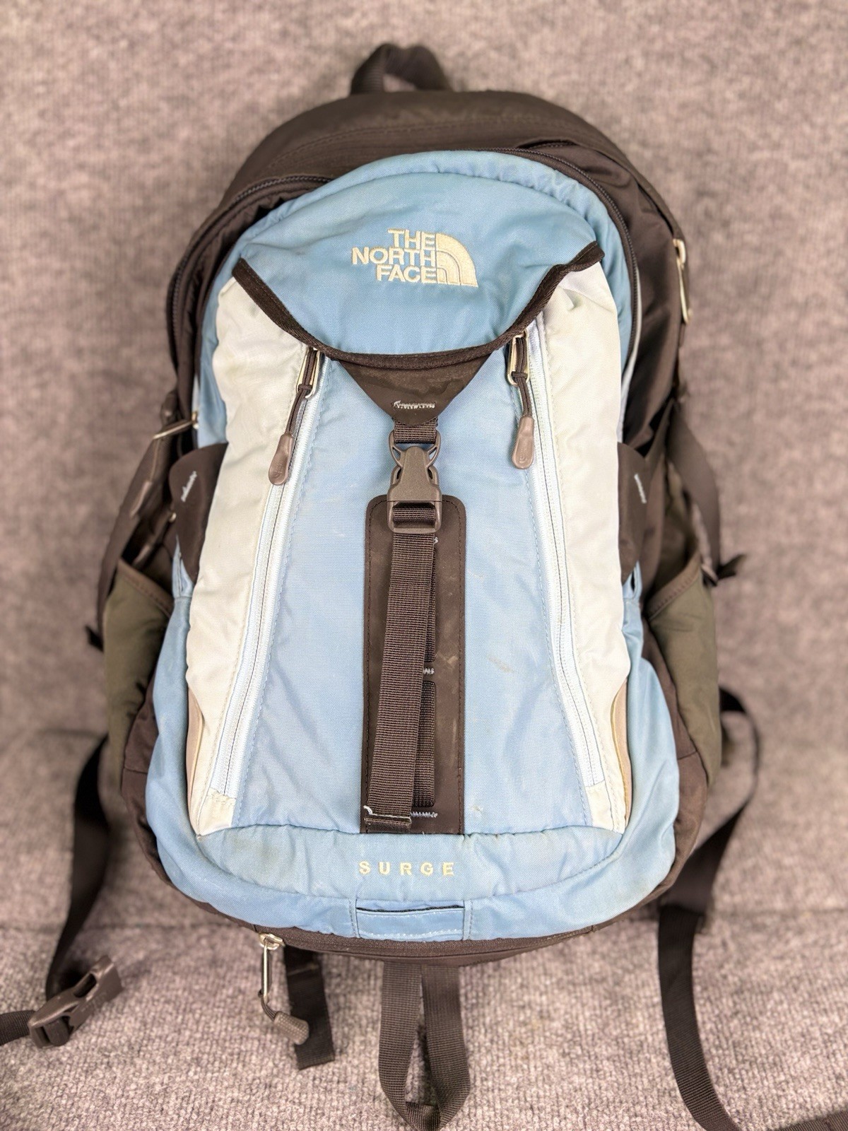 The North Face Surge Backpack Sky Blue Front Grey Back And Green Side Pockets