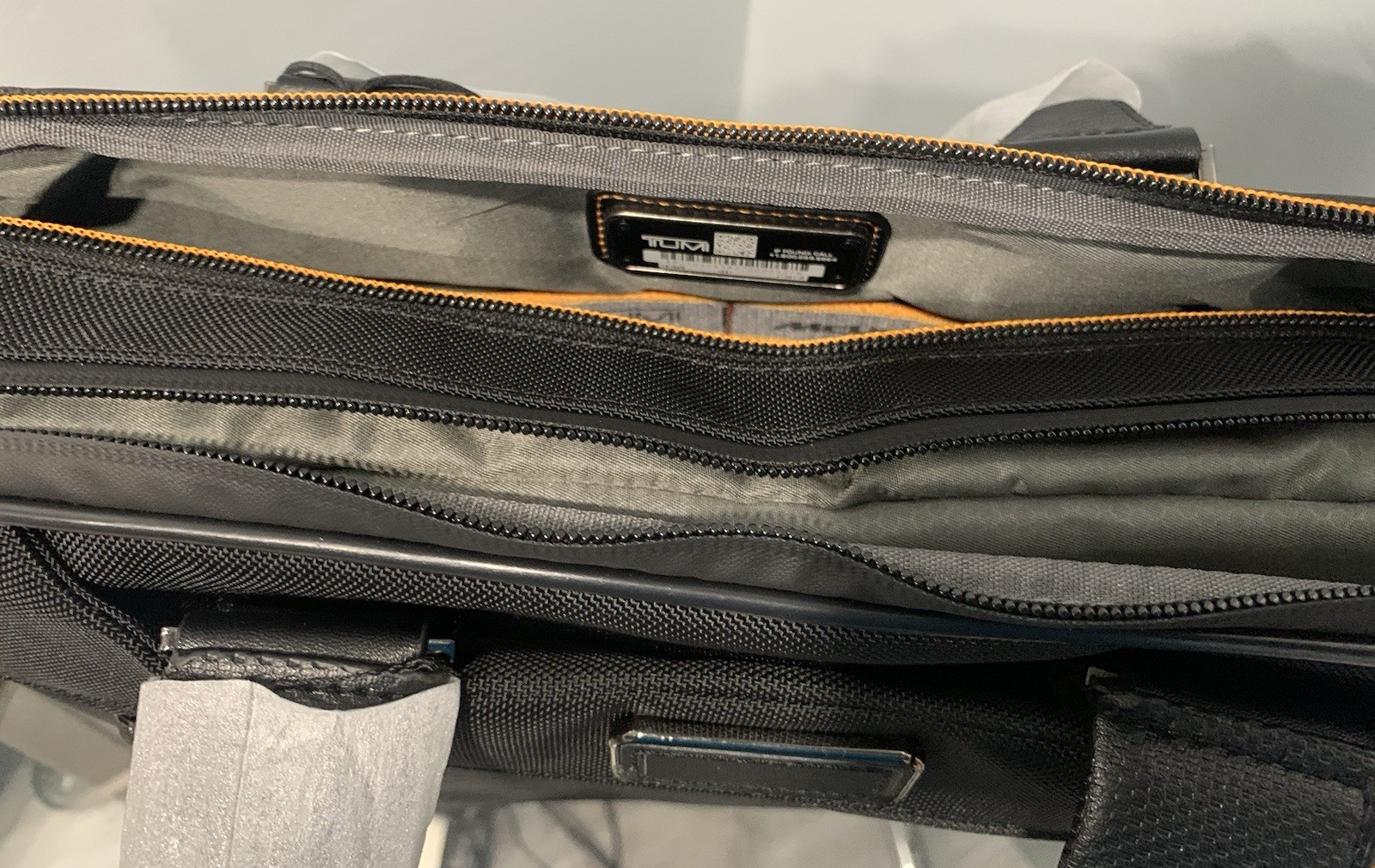 TUMI MCLAREN Axle Slim Brief $1095 Black/Orange
