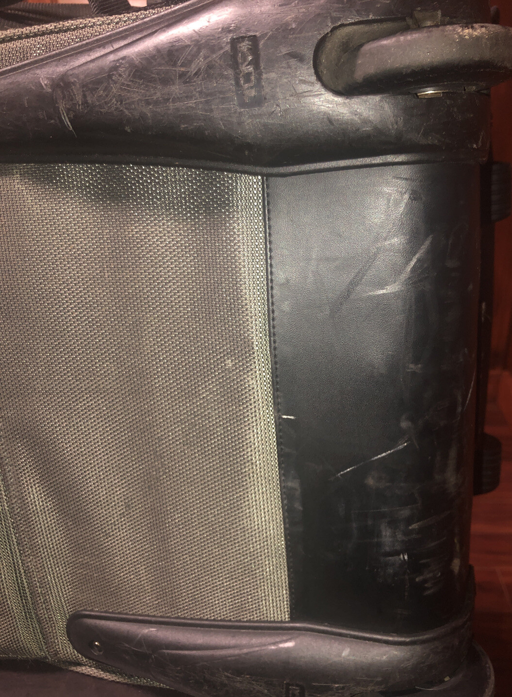 Used Tumi T2 Nylon Olive Green and Black Backpack Suitcase With Wheels.