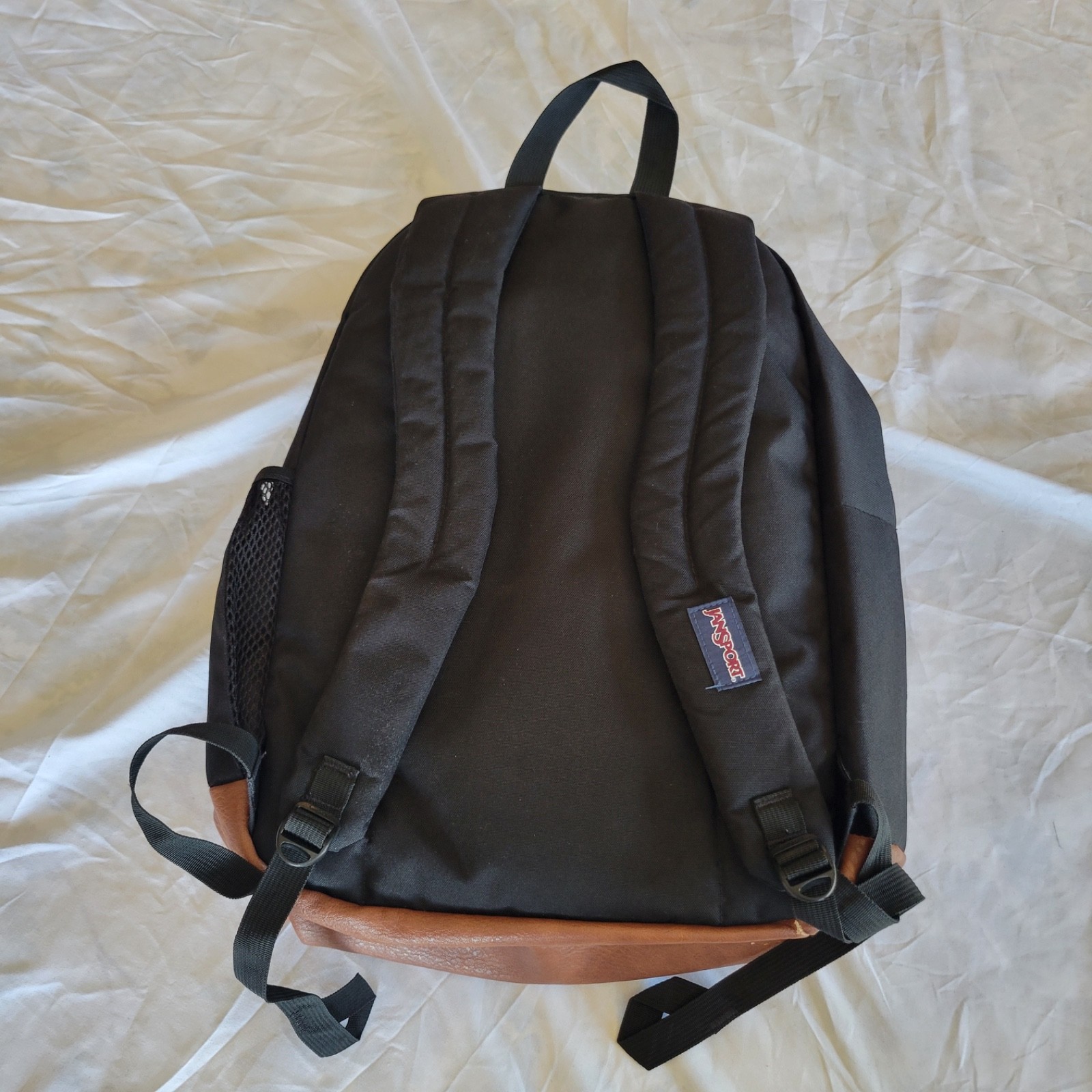 JanSport JS0A2SDD008 Cool Student Backpack – Black Faux Leather Bottom