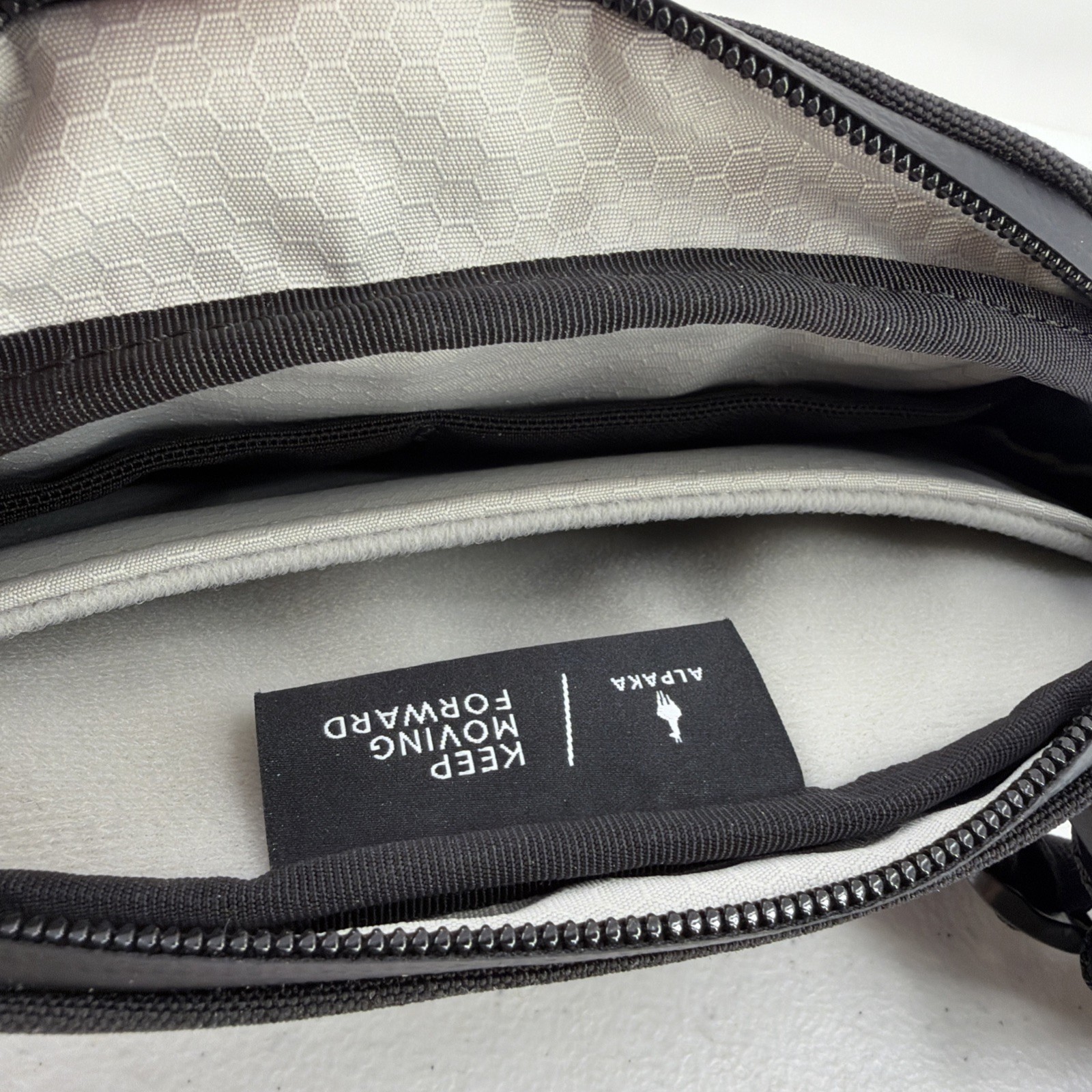 Alpaka Sling Bag Black Pockets Zip Adjustable Clean