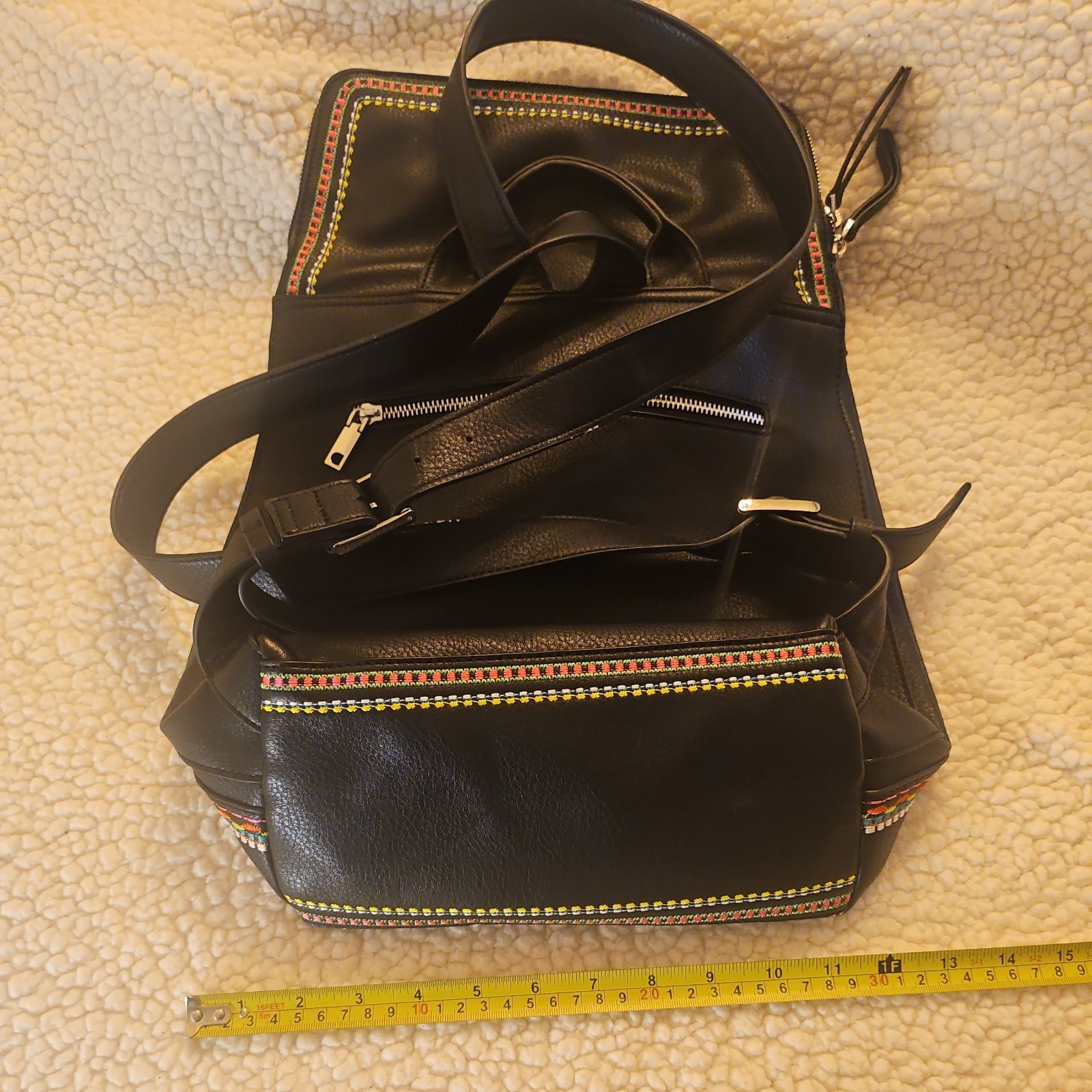 Midsize backpack,multicoloured embroidery,magnetic flap closure, zip, pockets.