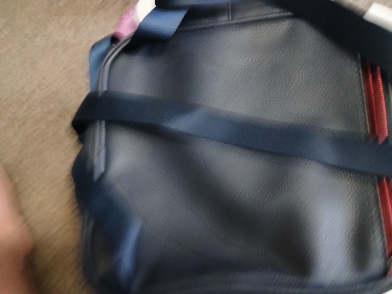 FILA SMALL BLACK BACKPACK WITH SIGNATURE ACROSS FRONT HAS 2 ZIPPERED SECTIONS