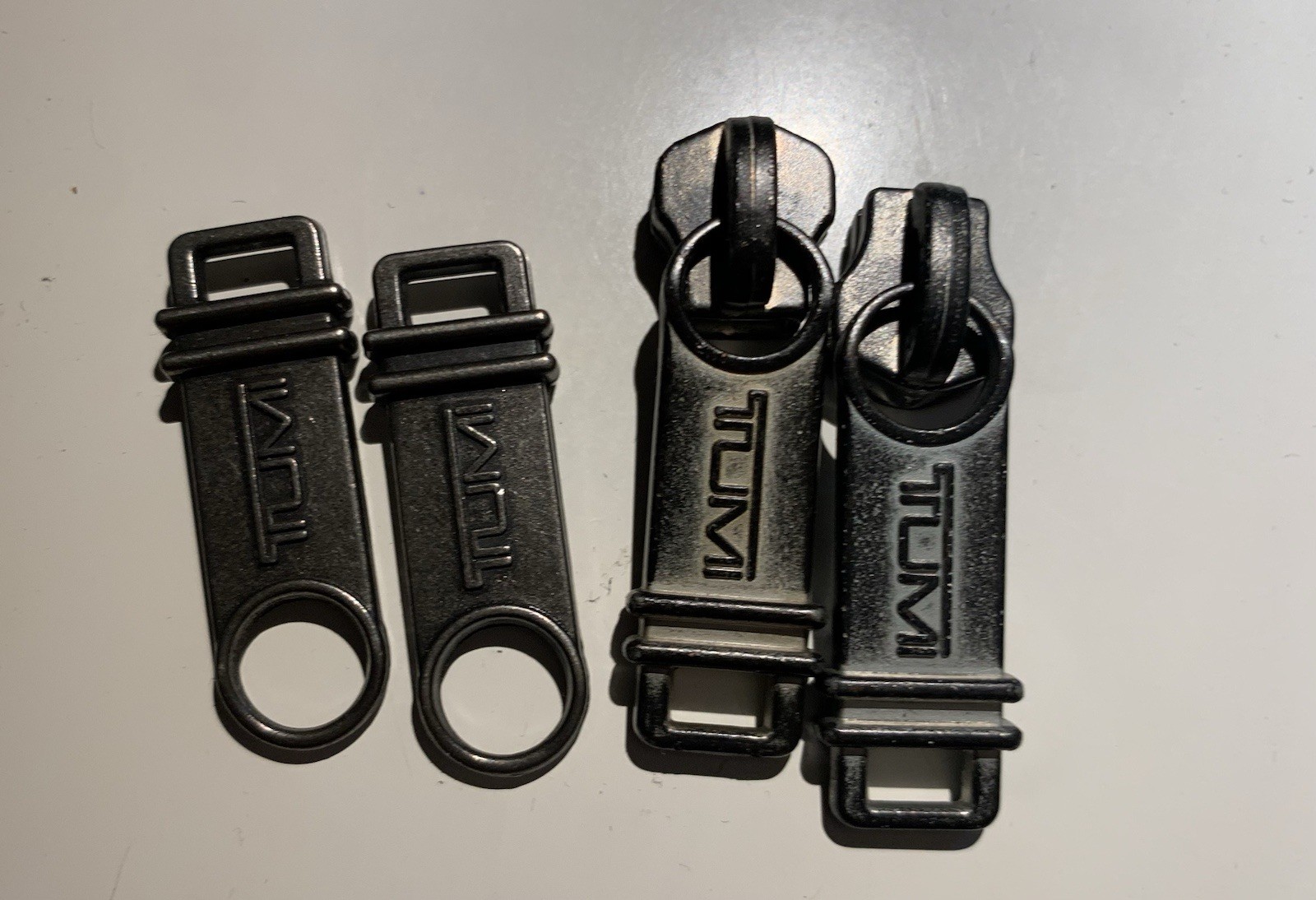 Tumi Alpha Bravo Zipper Pullers Set Of 4 $50