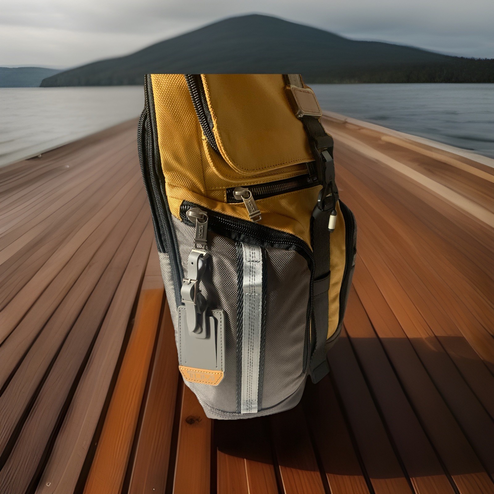 BRAND NEW Tumi Alpha Bravo Logistics Flap Lid Backpack. Grey/ Yellow