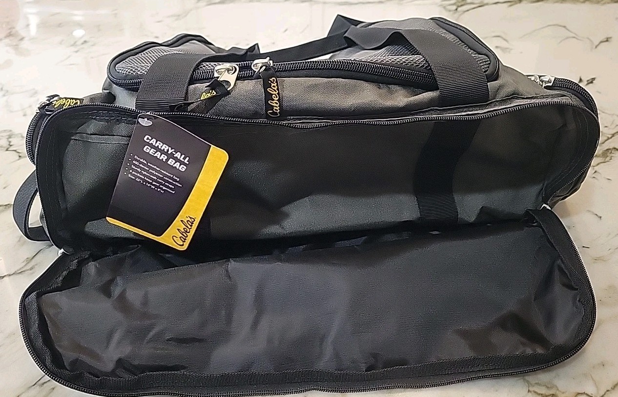 Cabela’s travel bag (6028). Zipper Closure. New. Gray Color. For Man Or Women.