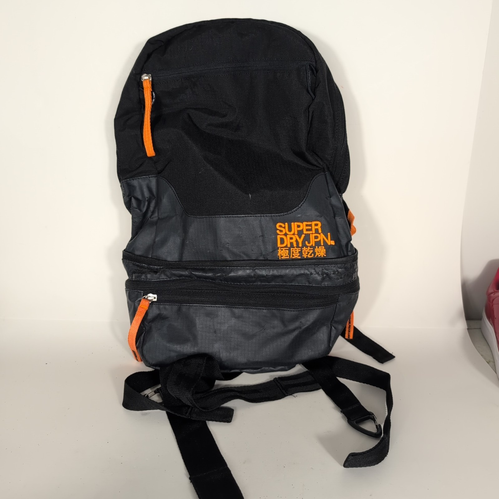 Superdry Tarp Backpack Black Orange Trim Travel Zip Pockets Water Resistant Bag