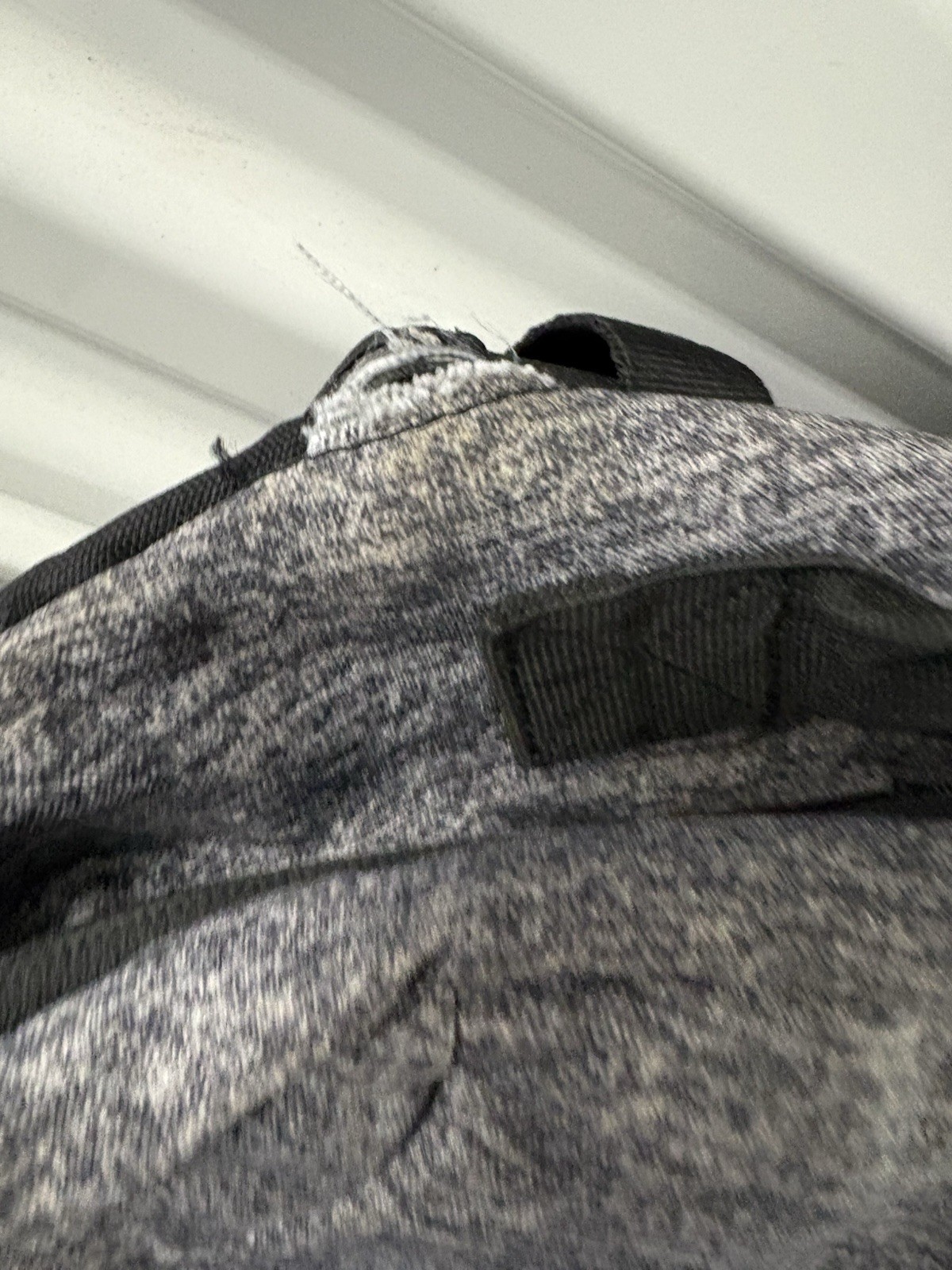 Adidas Defender backpack in grey heather material with black accents.