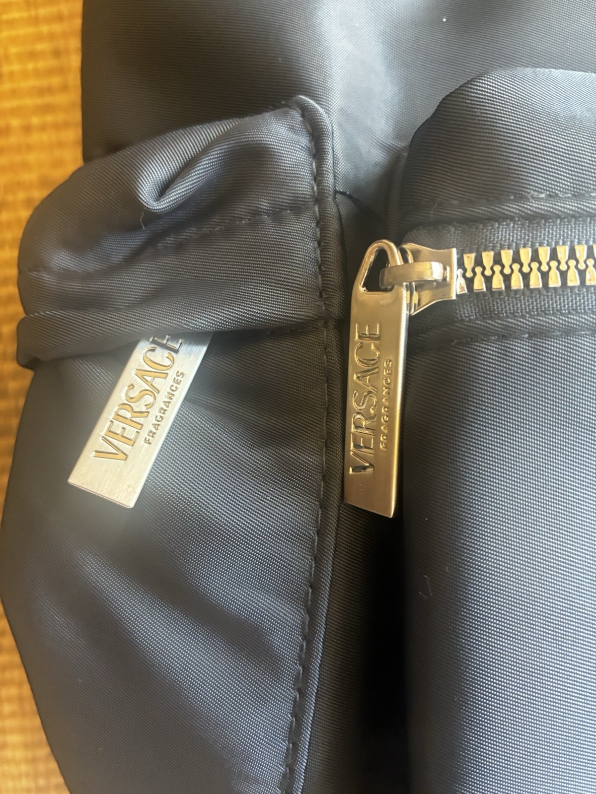 Versace Parfums Black Drawstring Backpack w/ Front Zip Pocket, Zip Closure
