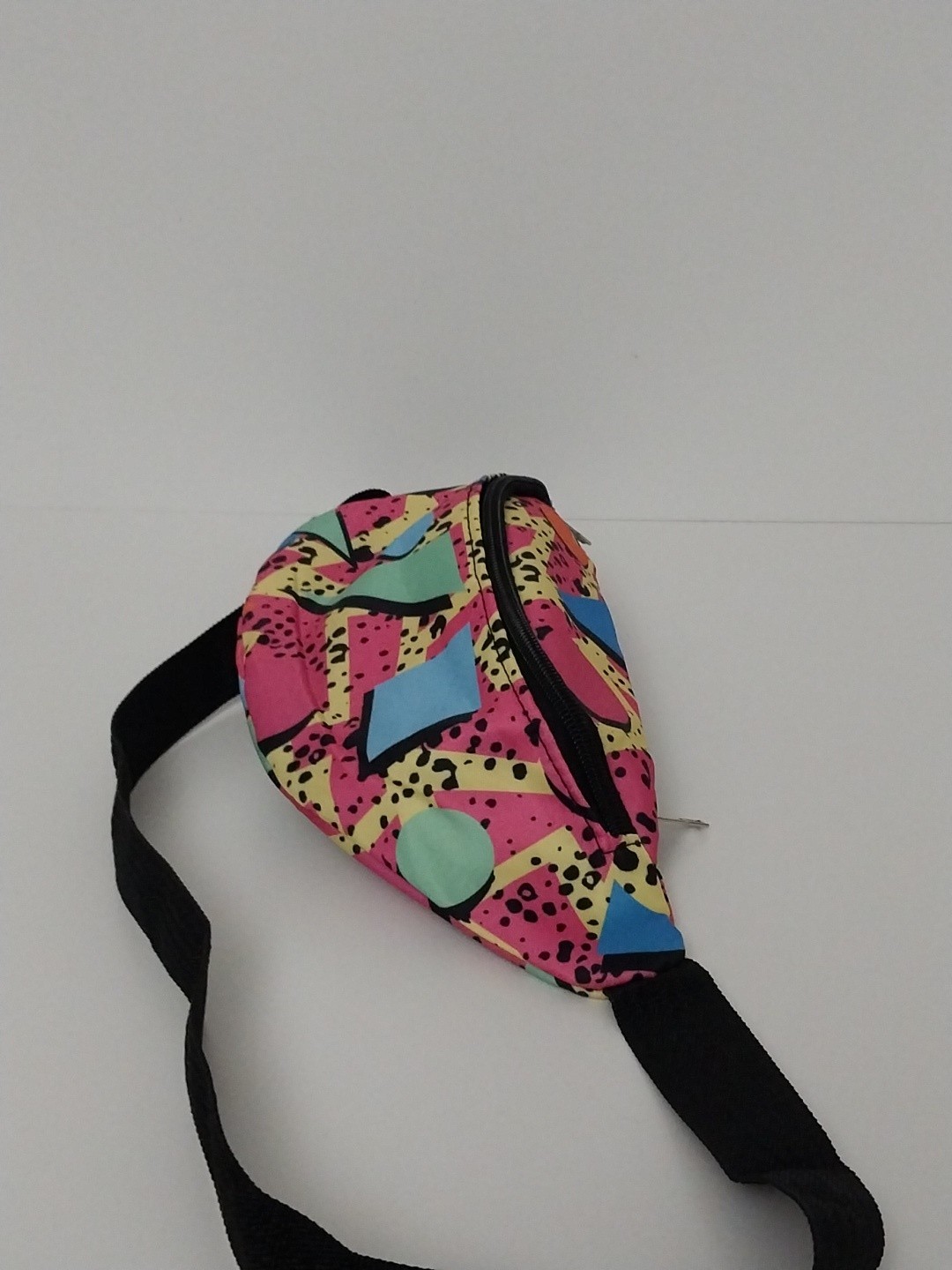 80s or 90s style Memphis pattern fanny pack with a black adjustable strap and…