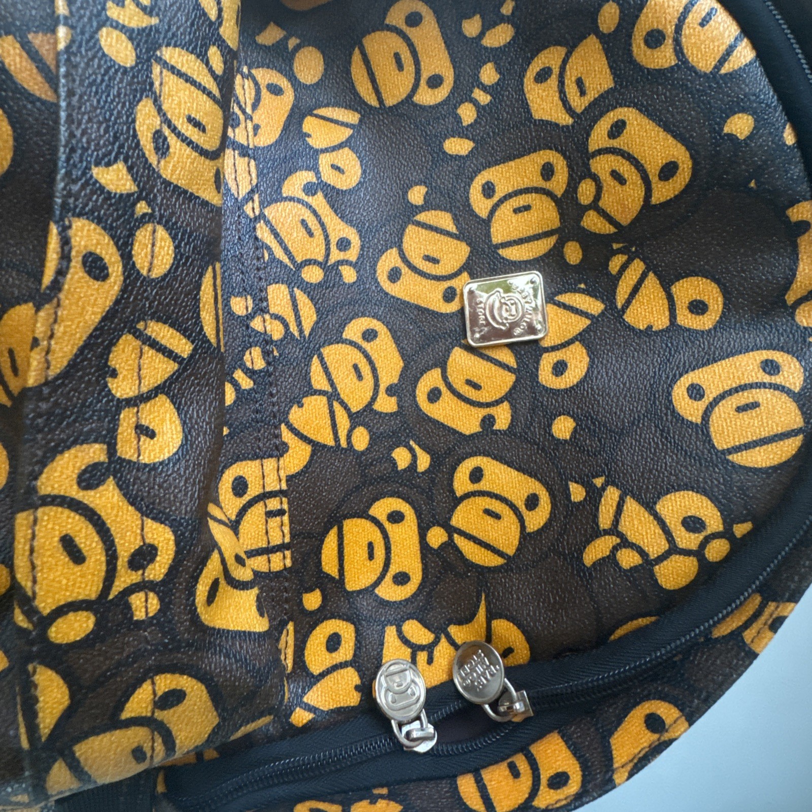 BAPE x Baby Milo Store “All Over” Print Faux Leather Daypack