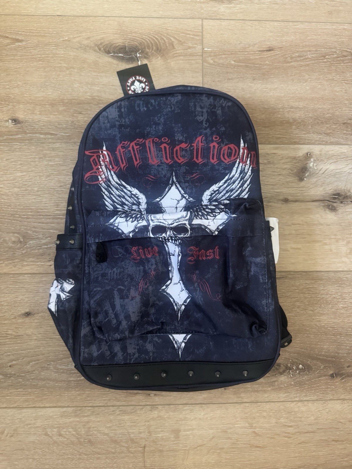RARE Affliction black & navy backpack with white & red skull with wings graphic