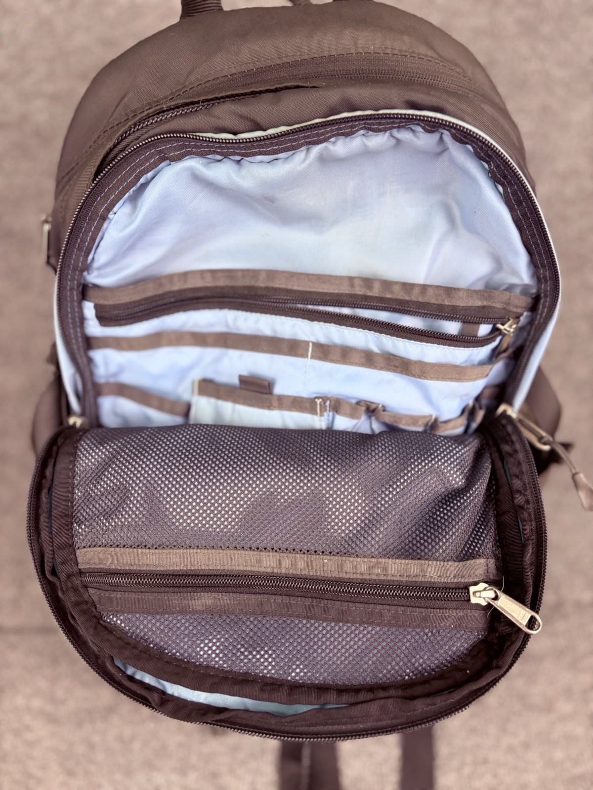 The North Face Surge Backpack Sky Blue Front Grey Back And Green Side Pockets