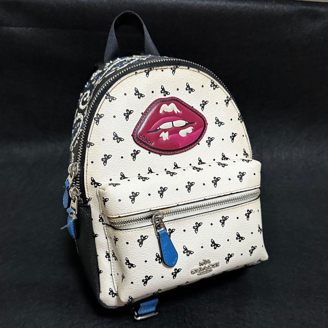 Coach Butterfly Lip Motif
