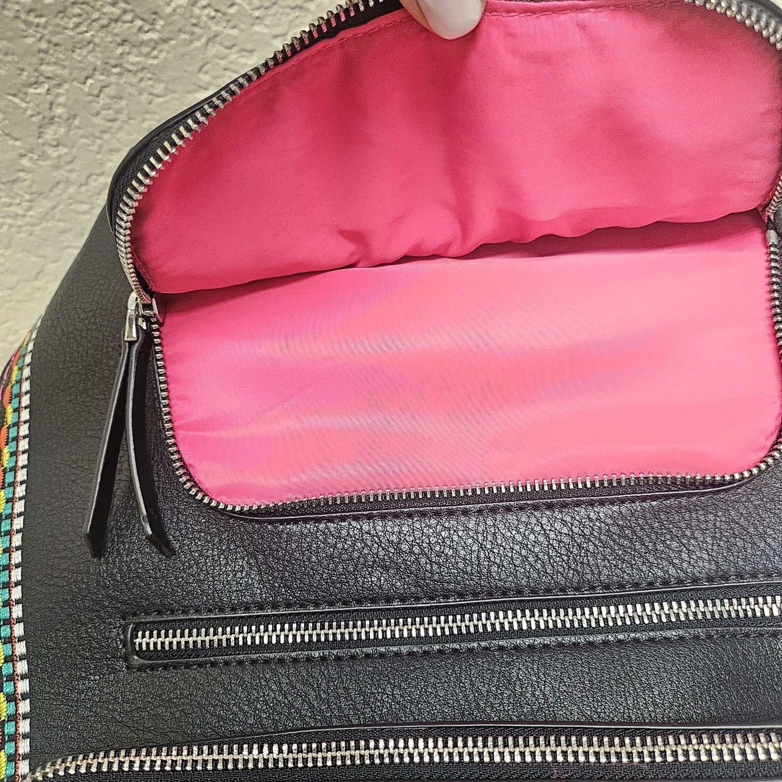 Midsize backpack,multicoloured embroidery,magnetic flap closure, zip, pockets.