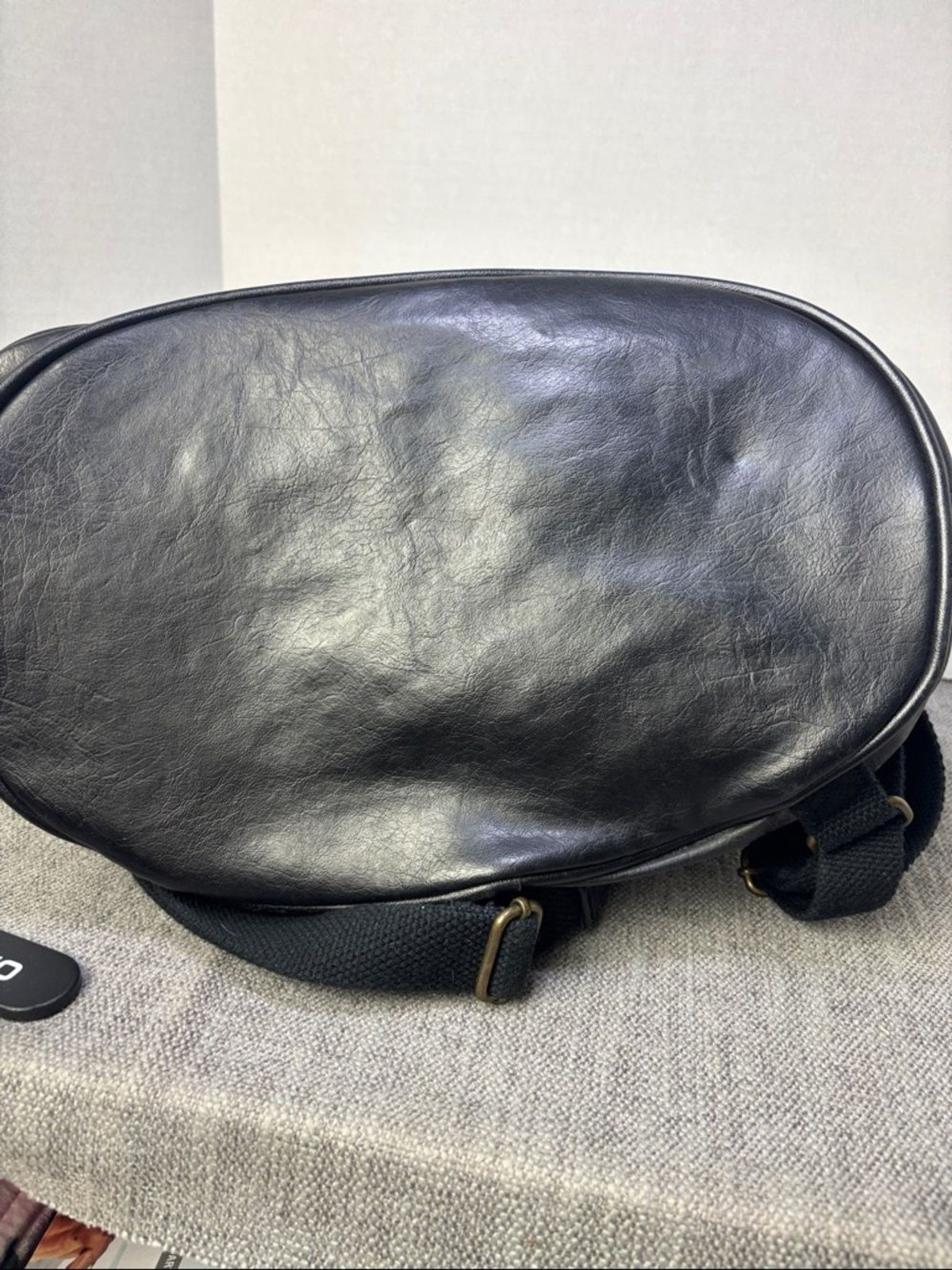 Tandem Black Leather Drawstring Backpack with Buckled Flap Cascade Falls