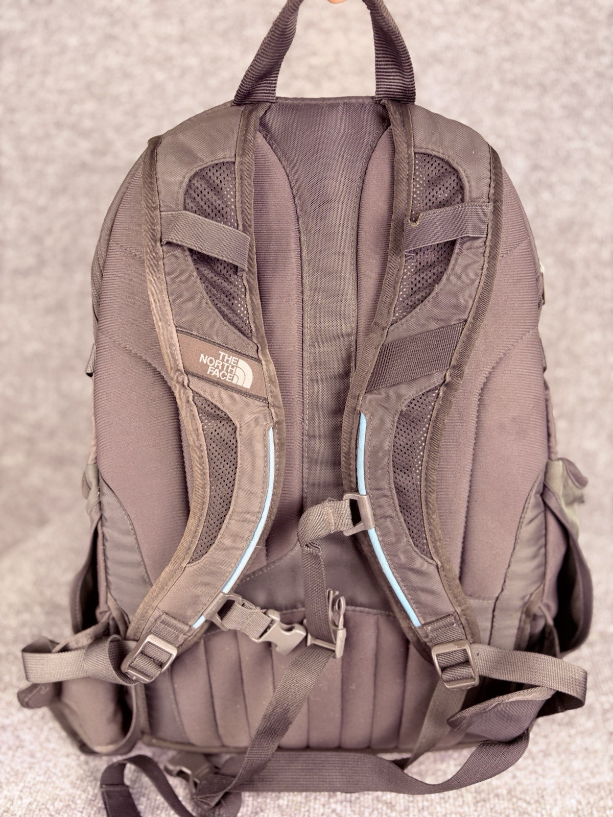 The North Face Surge Backpack Sky Blue Front Grey Back And Green Side Pockets