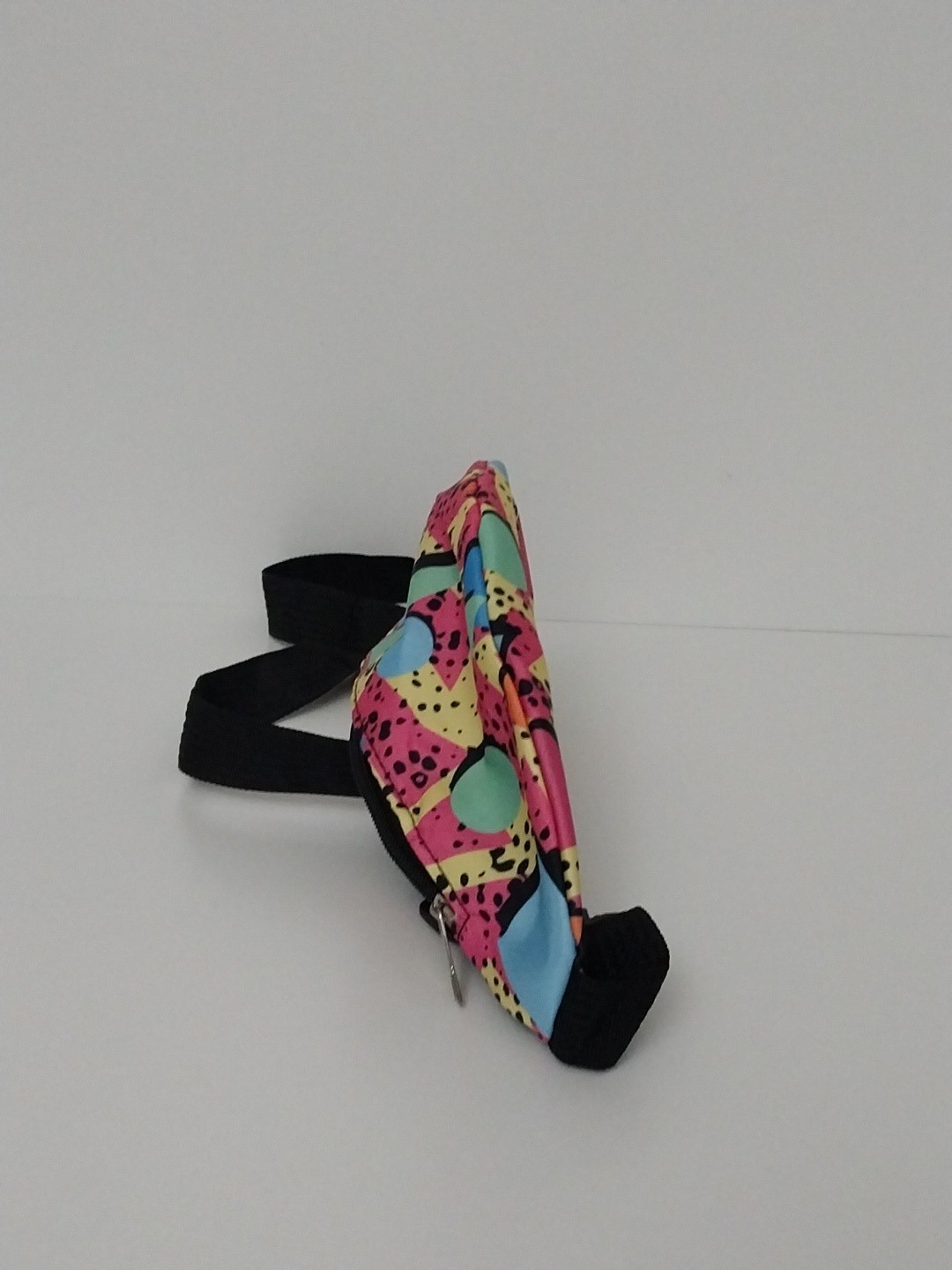 80s or 90s style Memphis pattern fanny pack with a black adjustable strap and…