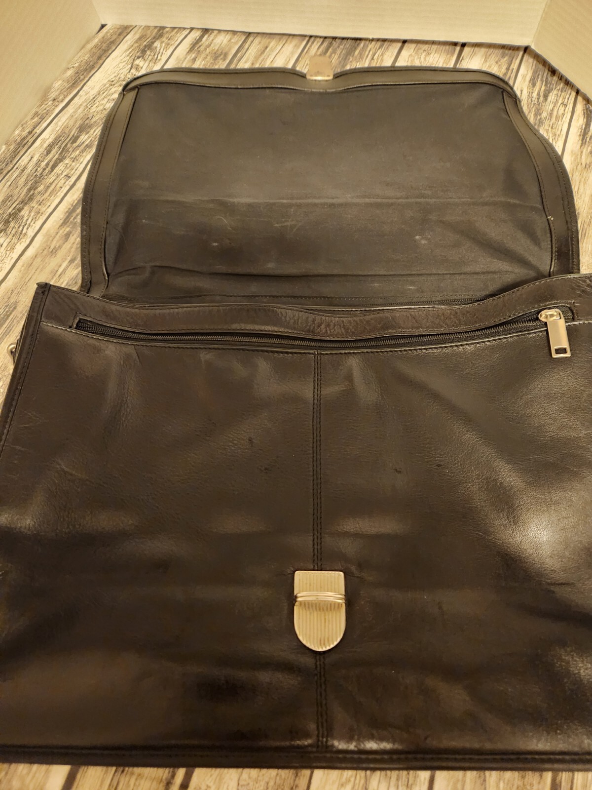Black leather briefcase. Soft, Expands. W/ shoulder Strap