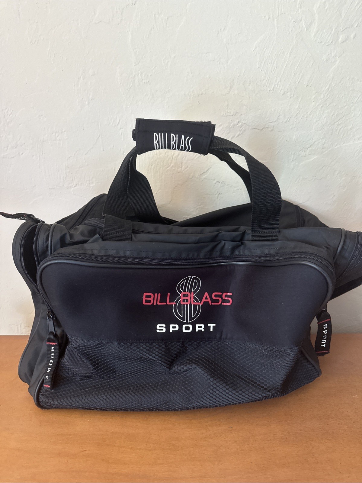 Bill Blass Sport branded duffel bag or gym bag. Black