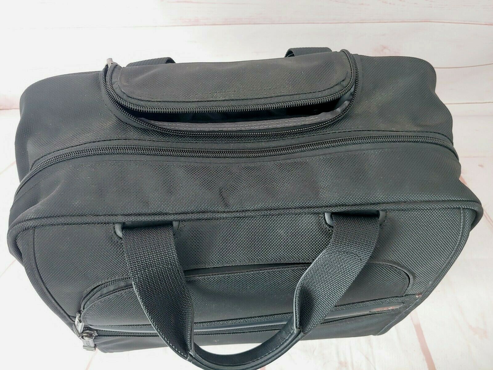 TUMI Black Wheeled Rolling Briefcase/Carry on Bag 15X13X6 Inches