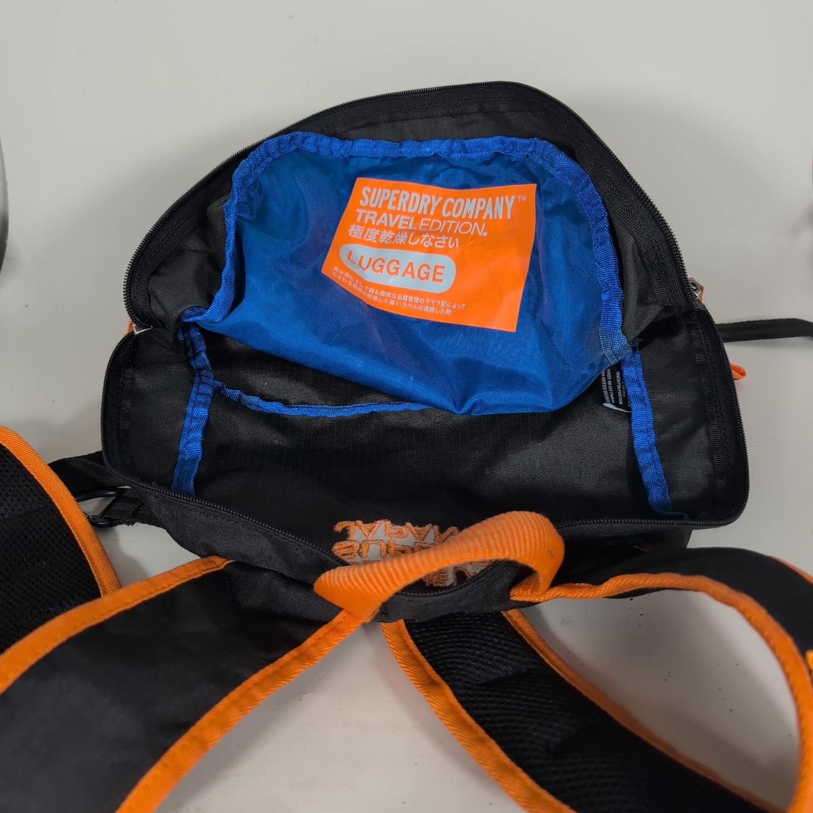 Superdry Tarp Backpack Black Orange Trim Travel Zip Pockets Water Resistant Bag
