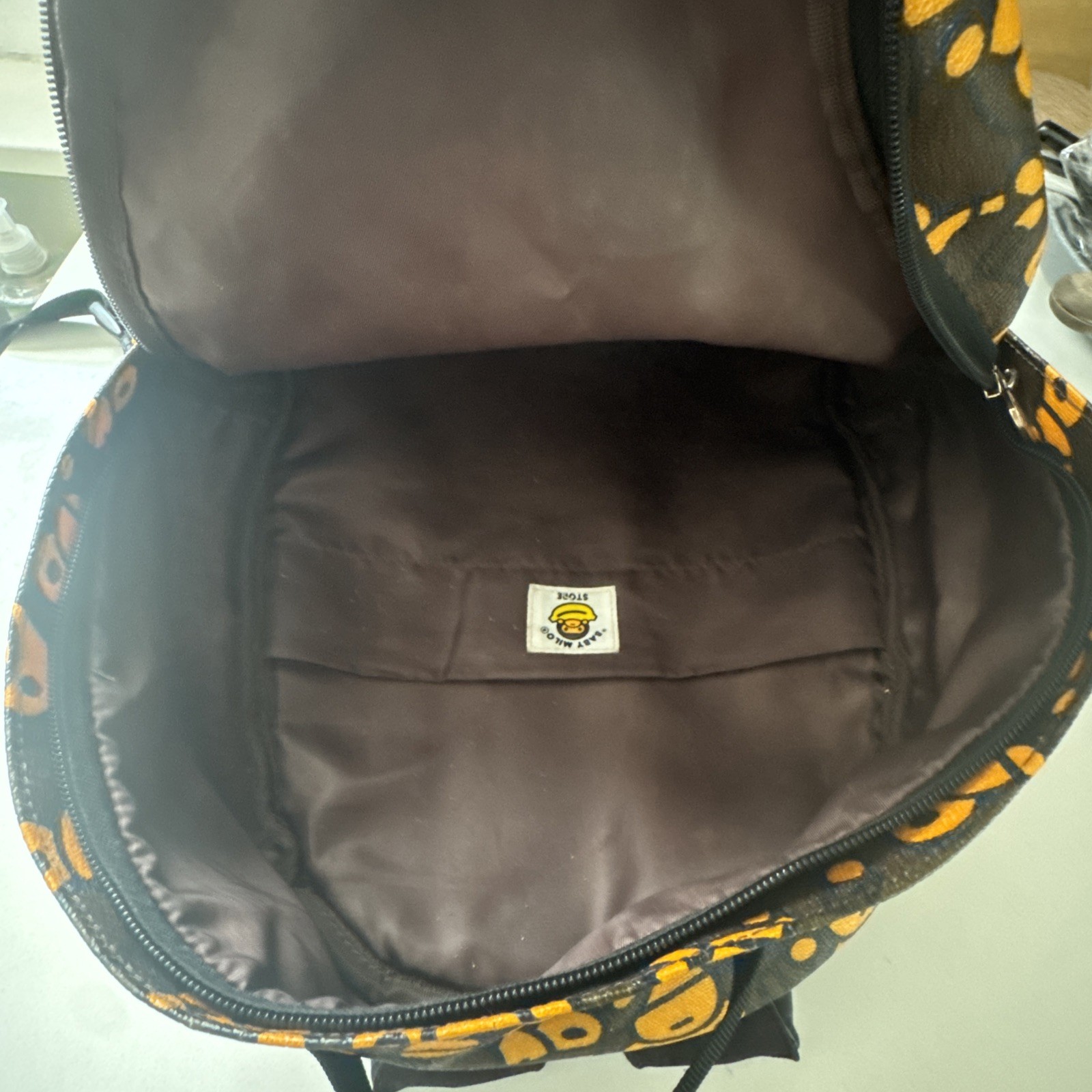 BAPE x Baby Milo Store “All Over” Print Faux Leather Daypack