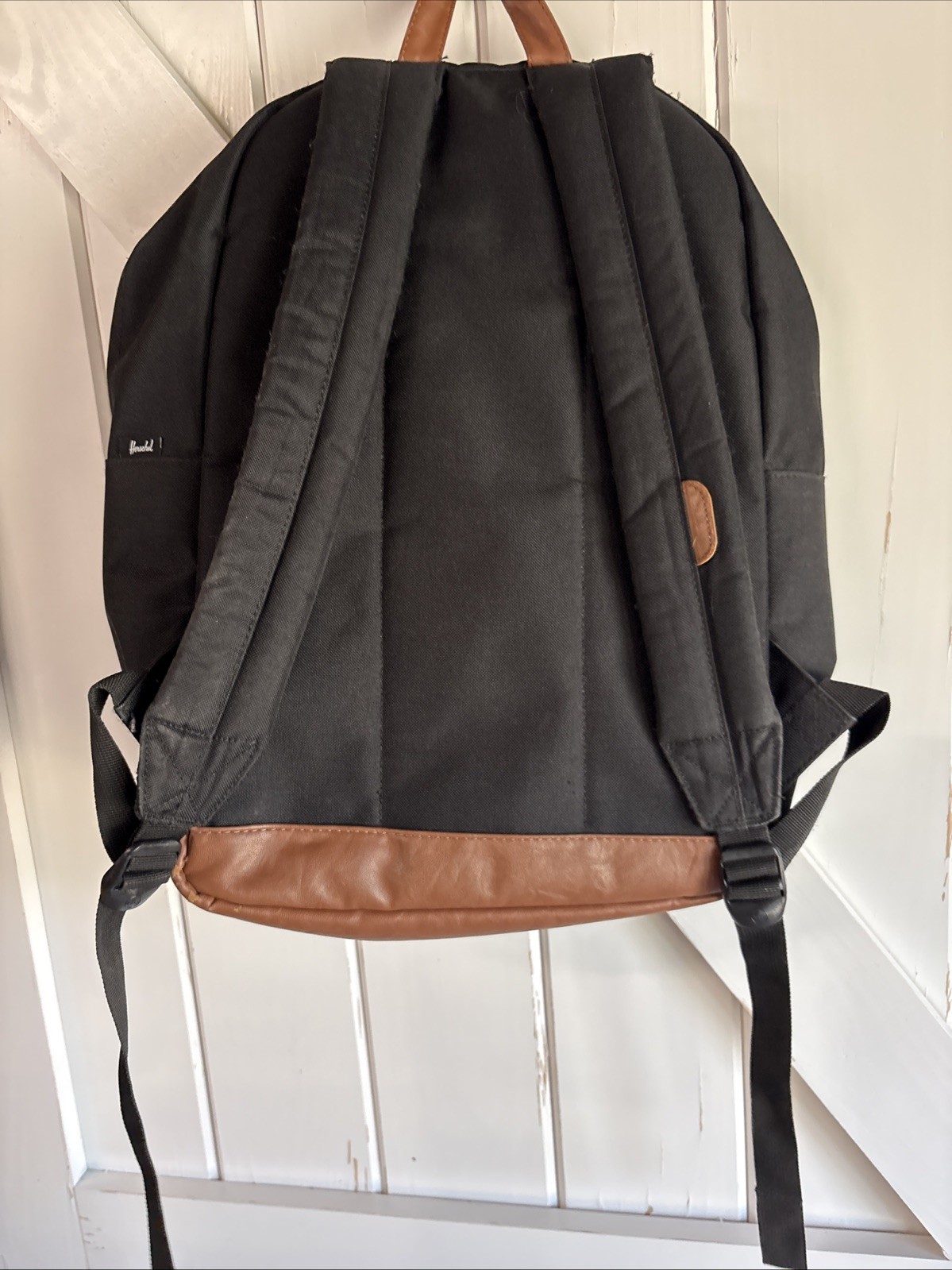 Herschel Supply Co. Pop Quiz backpack Black body with a brown synthetic leather